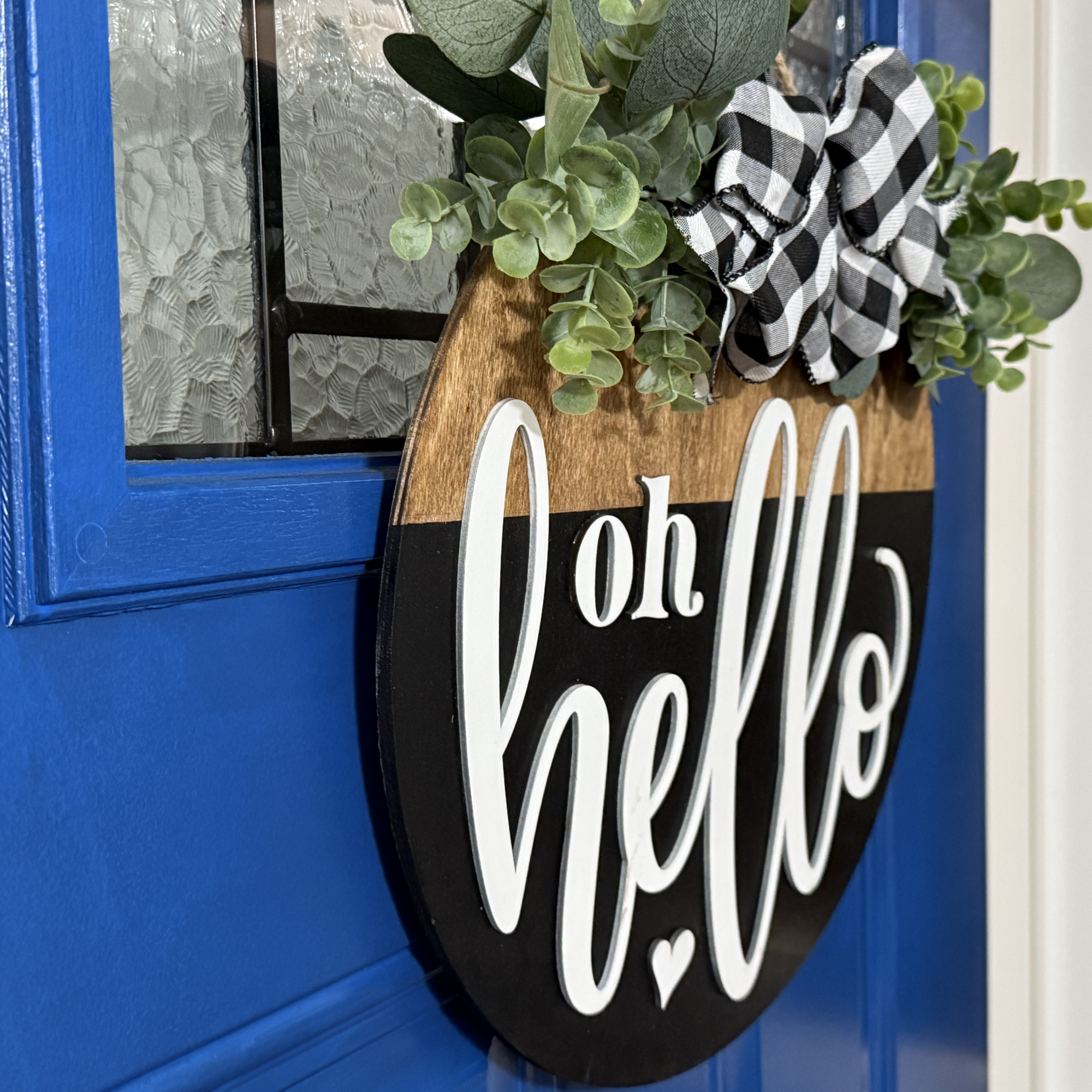 Oh Hello door hanger, side view, showing base thickness and layered wood details