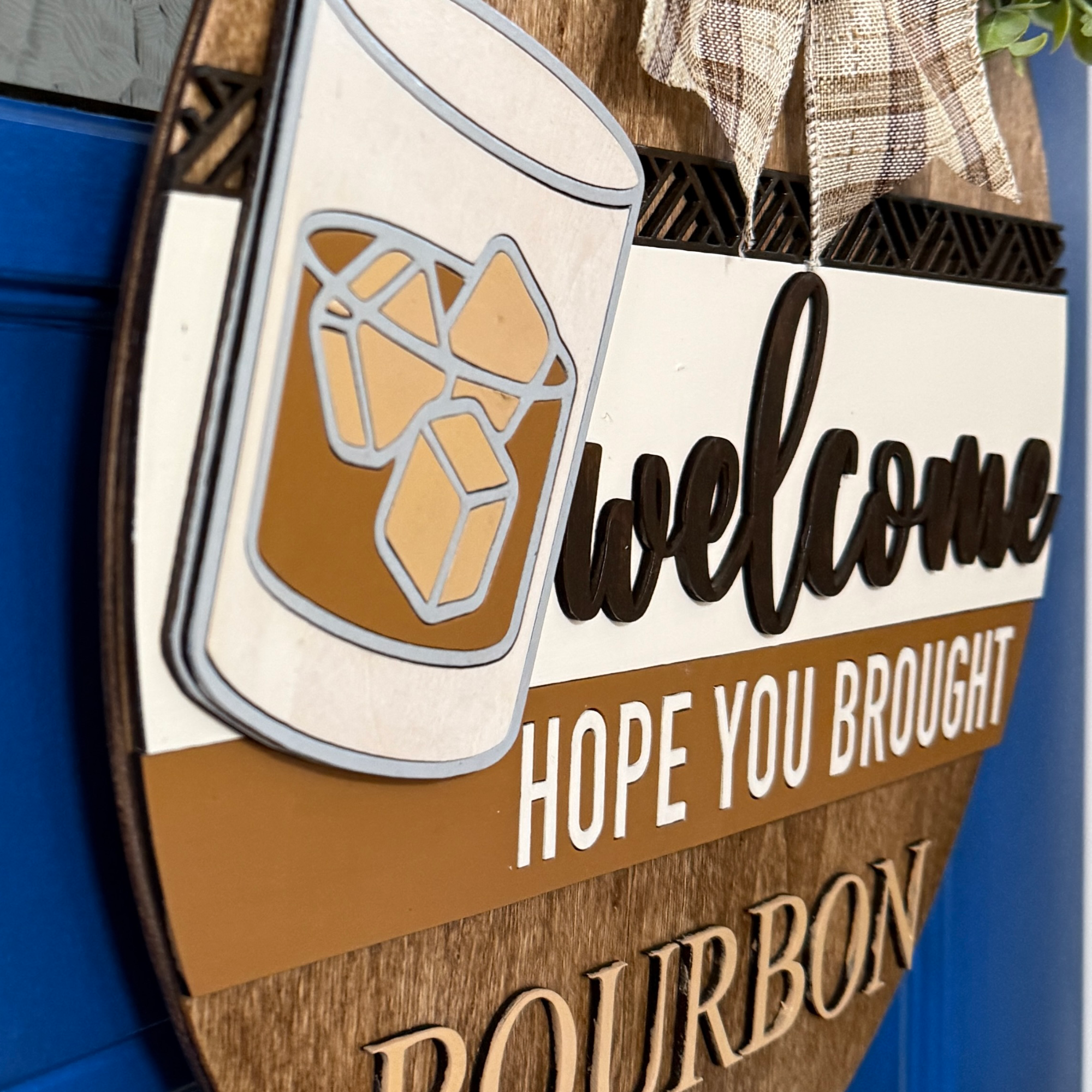 Close-up of large “BOURBON” lettering carved into lower wood section