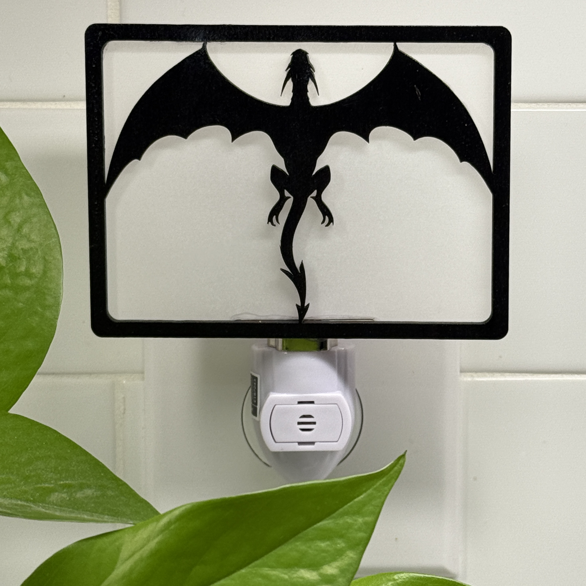 Flying Dragon night light unlit – silhouette of a dragon soaring with wings outstretched.