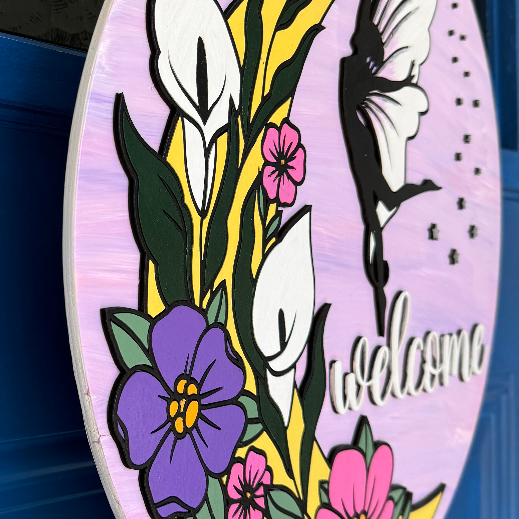 Side profile of 1/4 inch thick layered wood fairy welcome door hanger showing dimensional depth