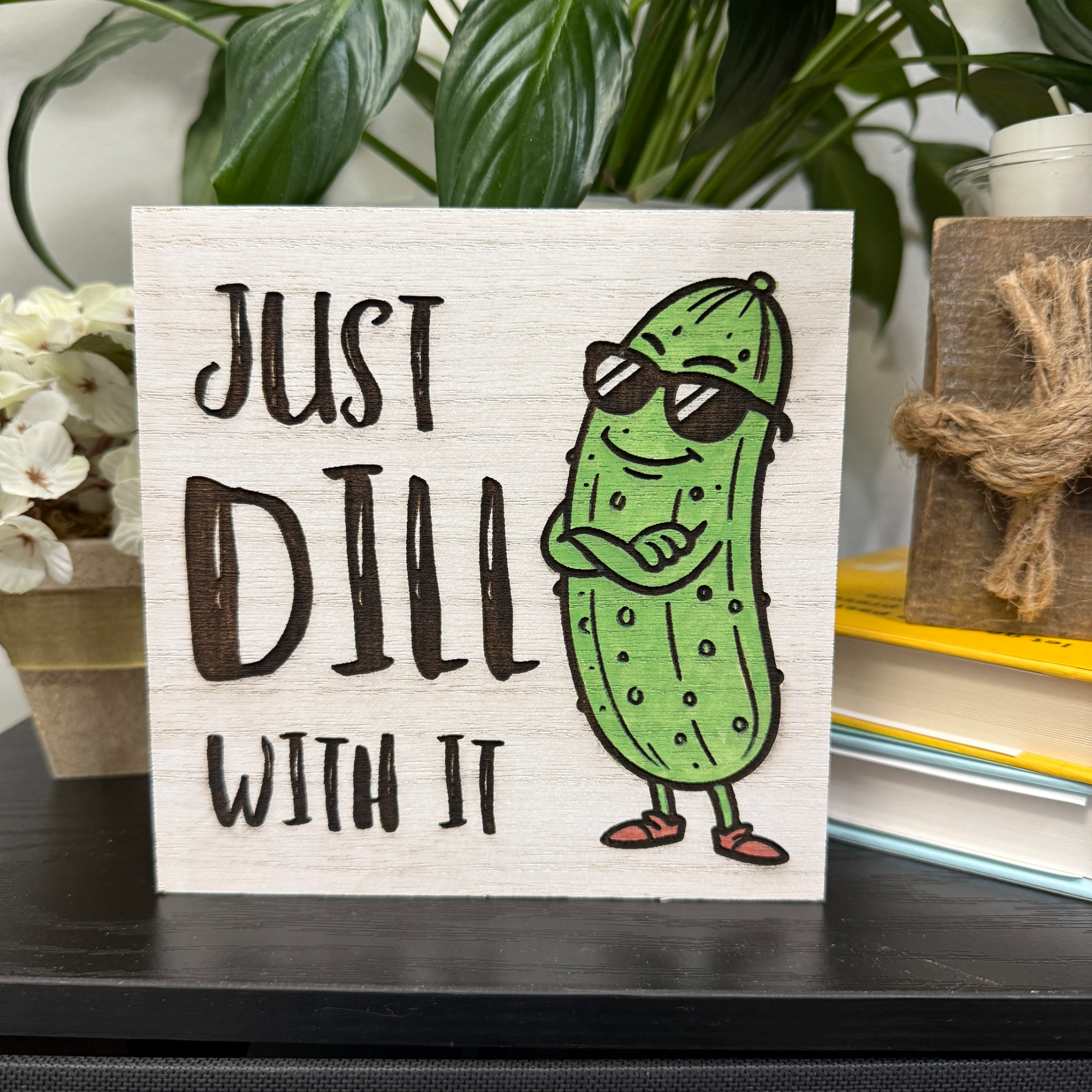 Funny “Just Dill With It” wood sign featuring a cartoon pickle wearing sunglasses on a natural wood background