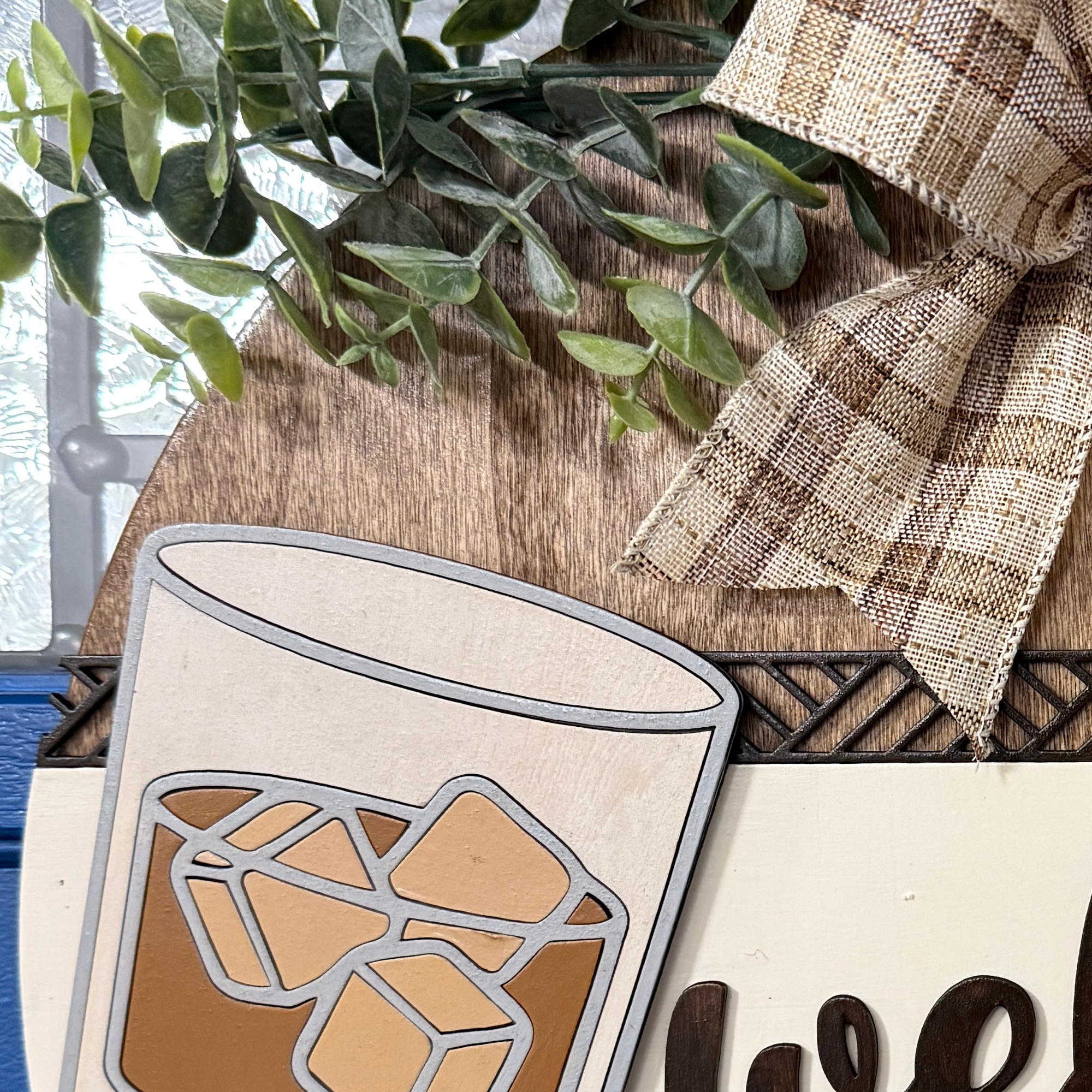 Close-up of bourbon glass with ice cubes and amber liquid detail