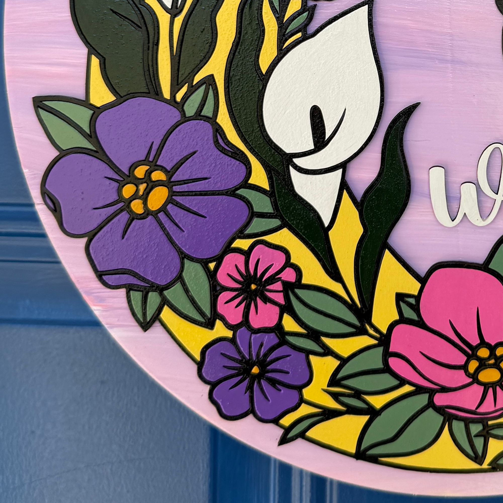 Close-up of layered wood construction and painted edge on pink floral fairy door hanger