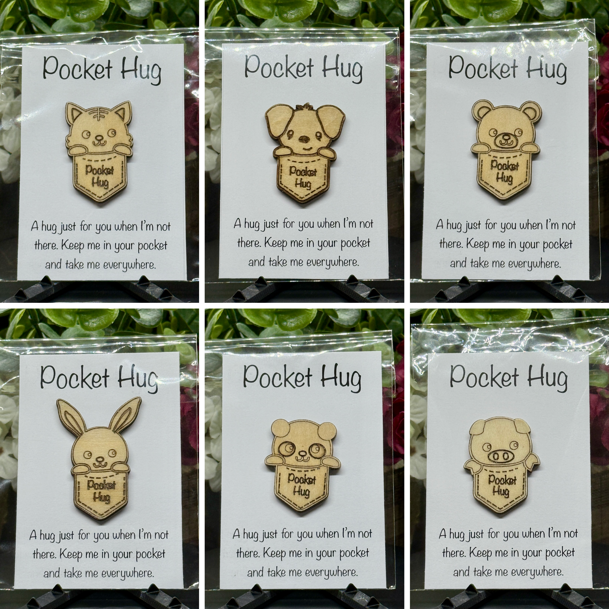 Collage of six animal Pocket Hug tokens on printed cards with floral background – cat, dog, bear, rabbit, panda, and pig