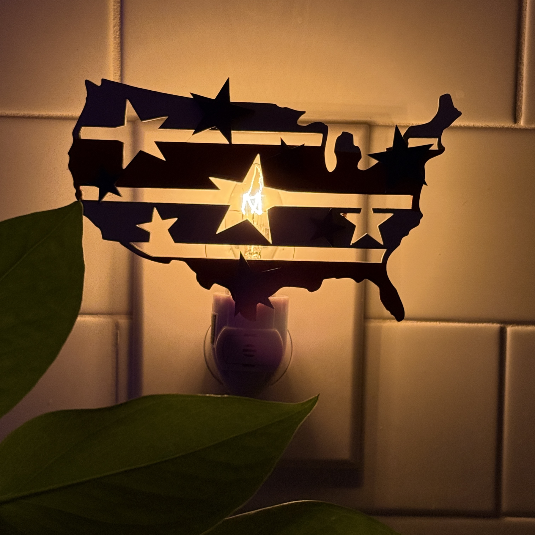 Glowing night light shaped like the USA with stars and stripes design
