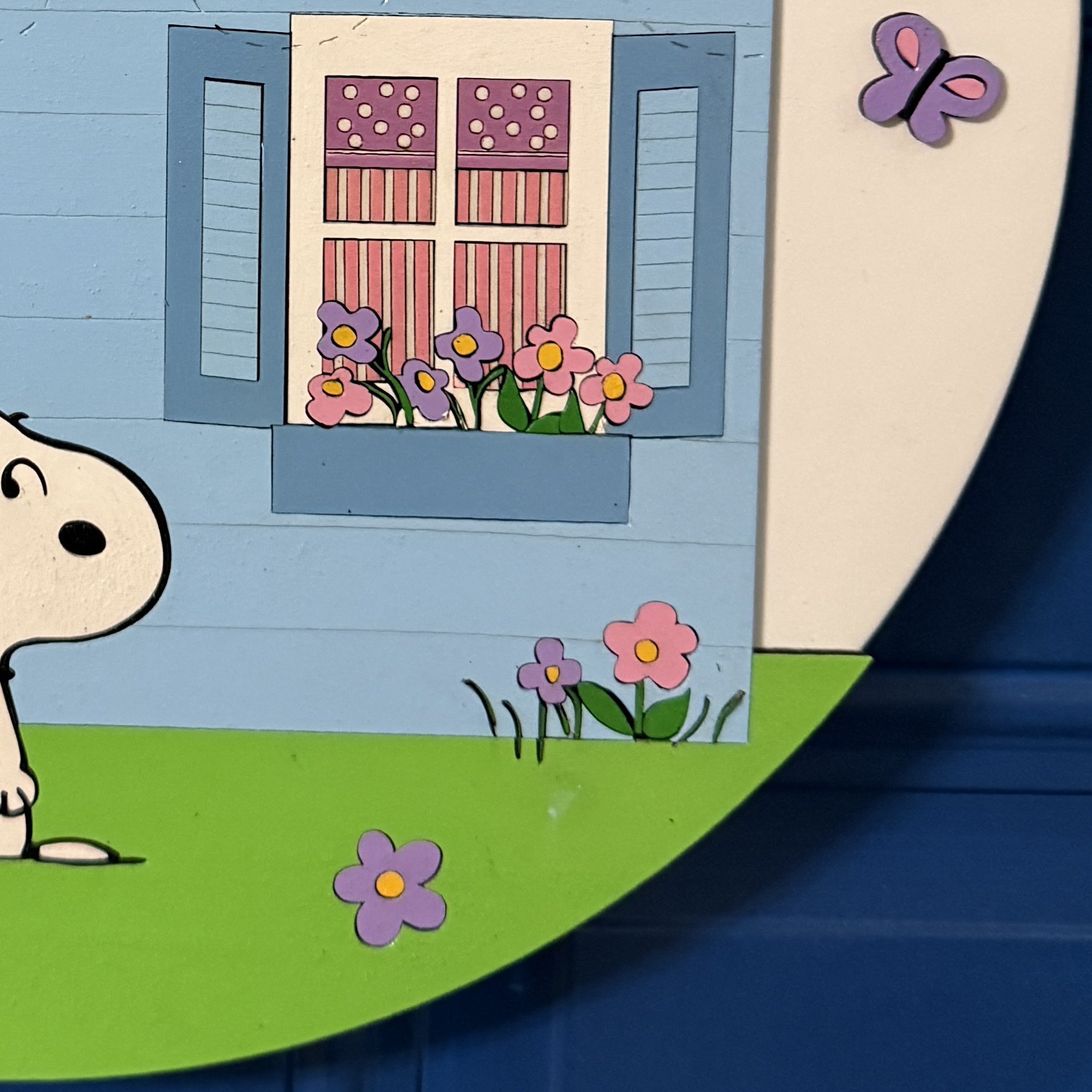 Close-up of window and flower box detail on house with colorful accents