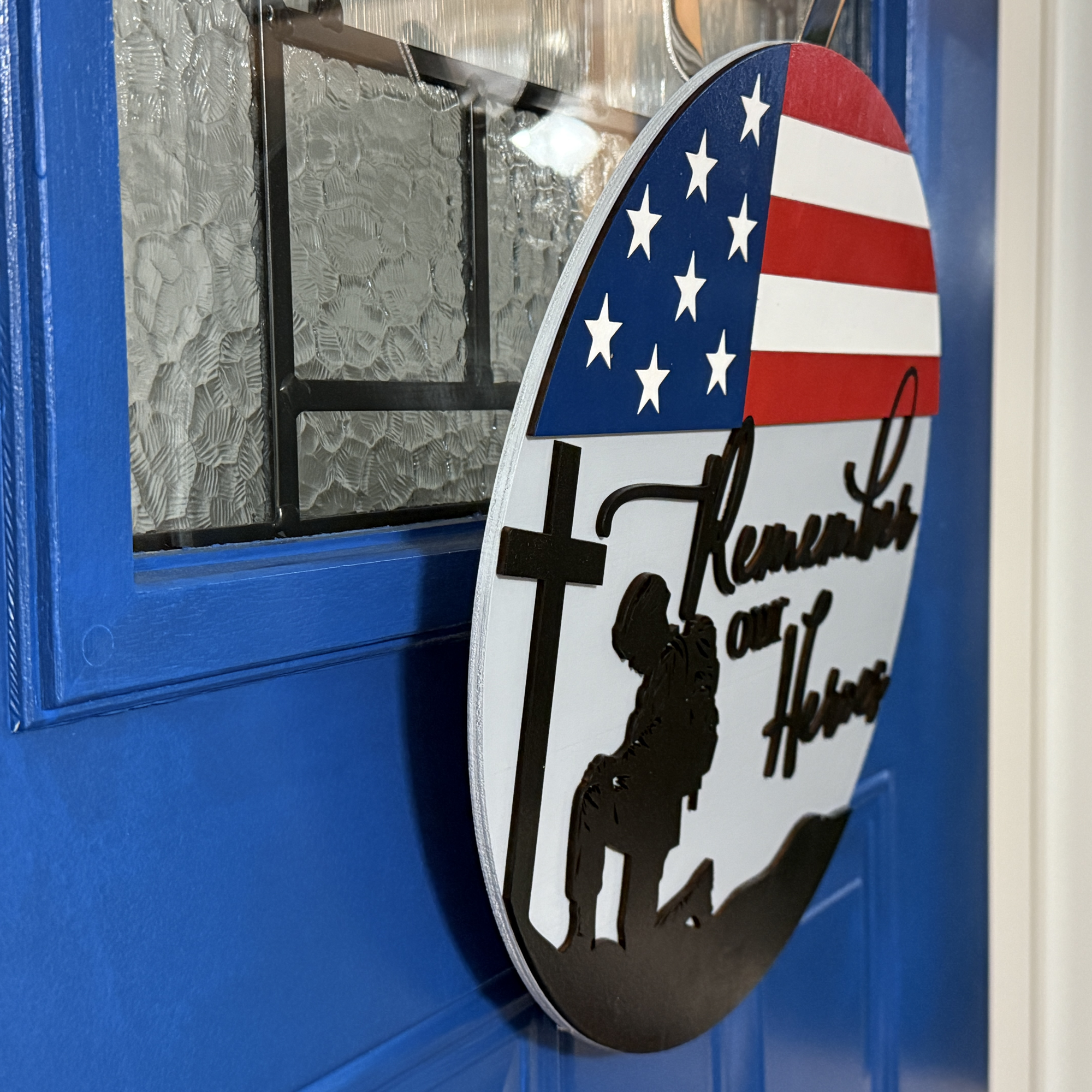Remember Our Heroes door hanger, side view, showing base thickness and layered wood details