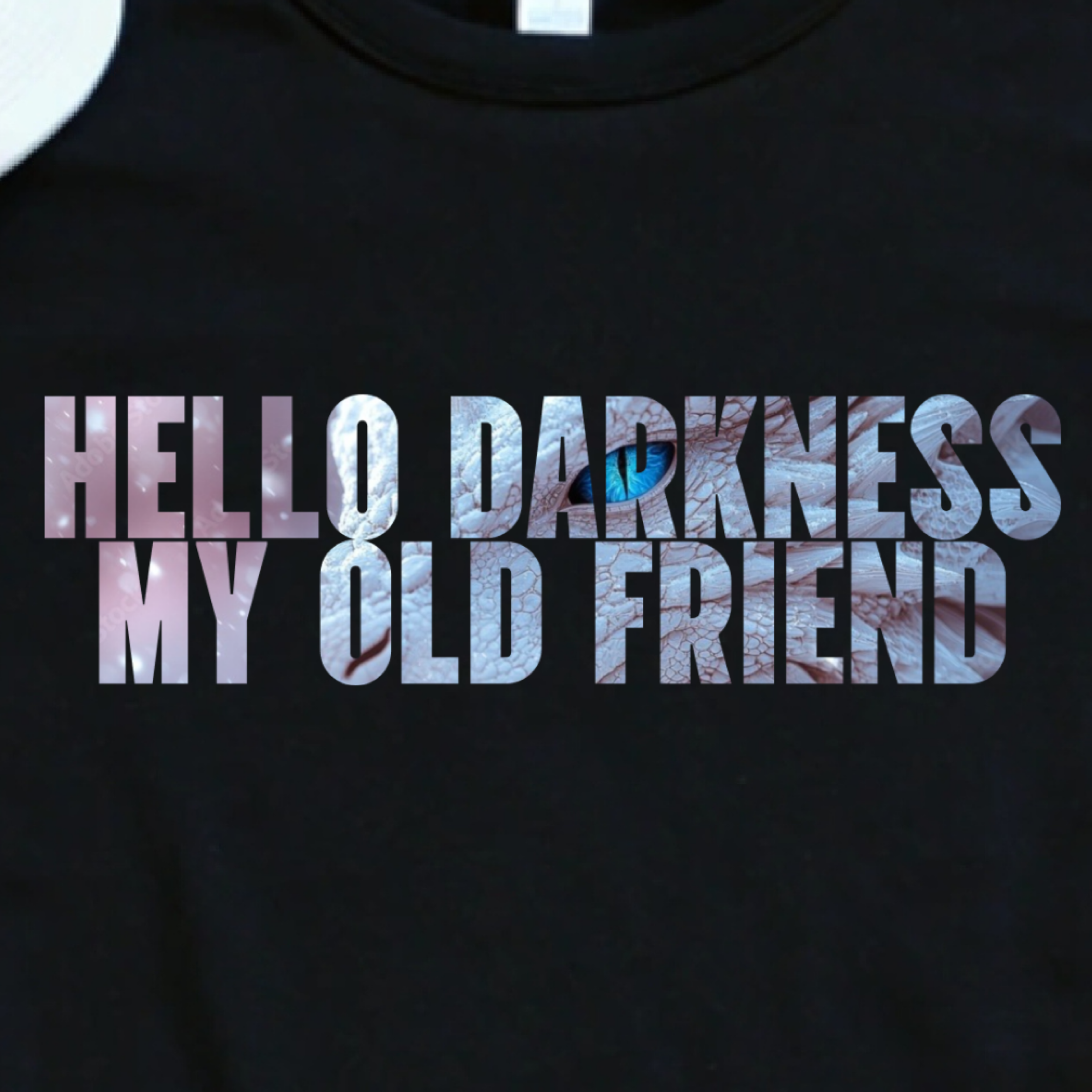 Close-up of white fantasy shirt with hello darkness my old friend text and white dragon cut out detail