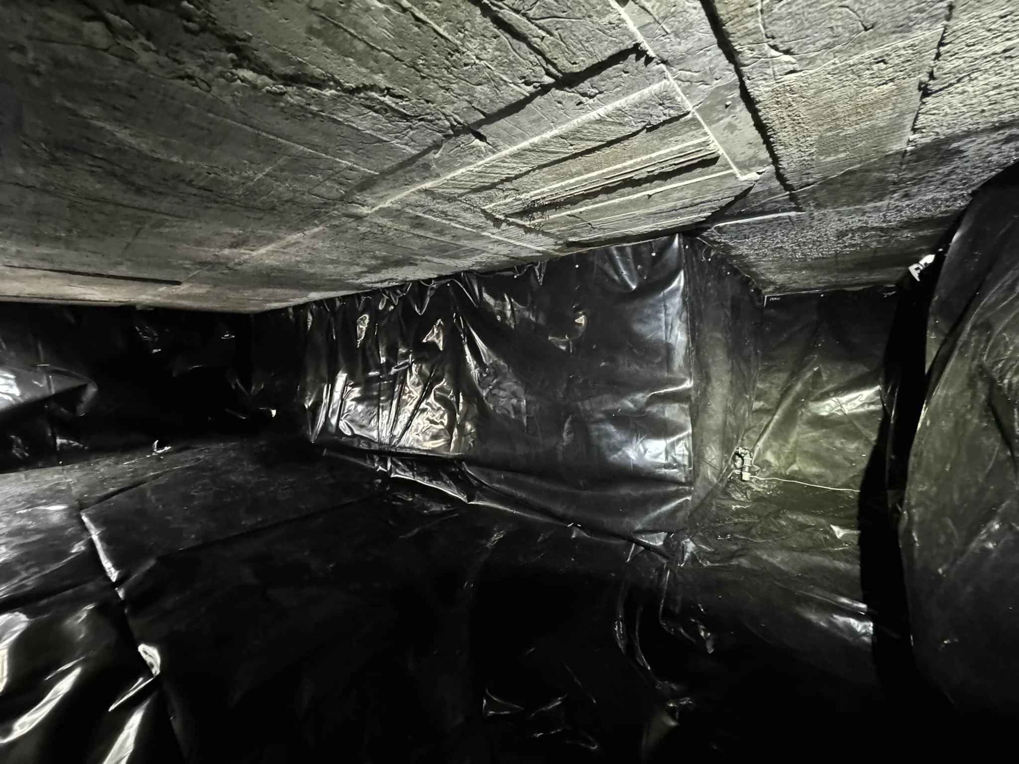 Tankliner installed to subfloor cuboid tank with odd shaped extension welded into Tankliner