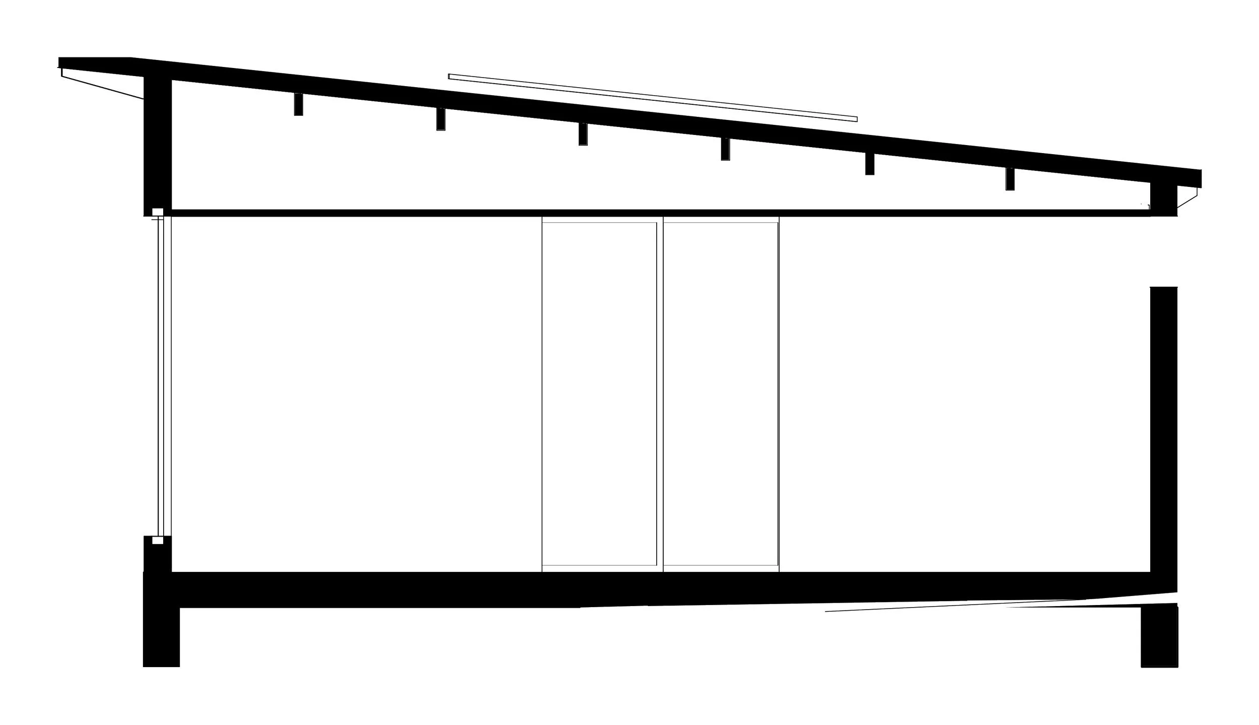 Section through the house showing the skillion roof, north clerestory windows and the cut walls, floor and footings in solid black.