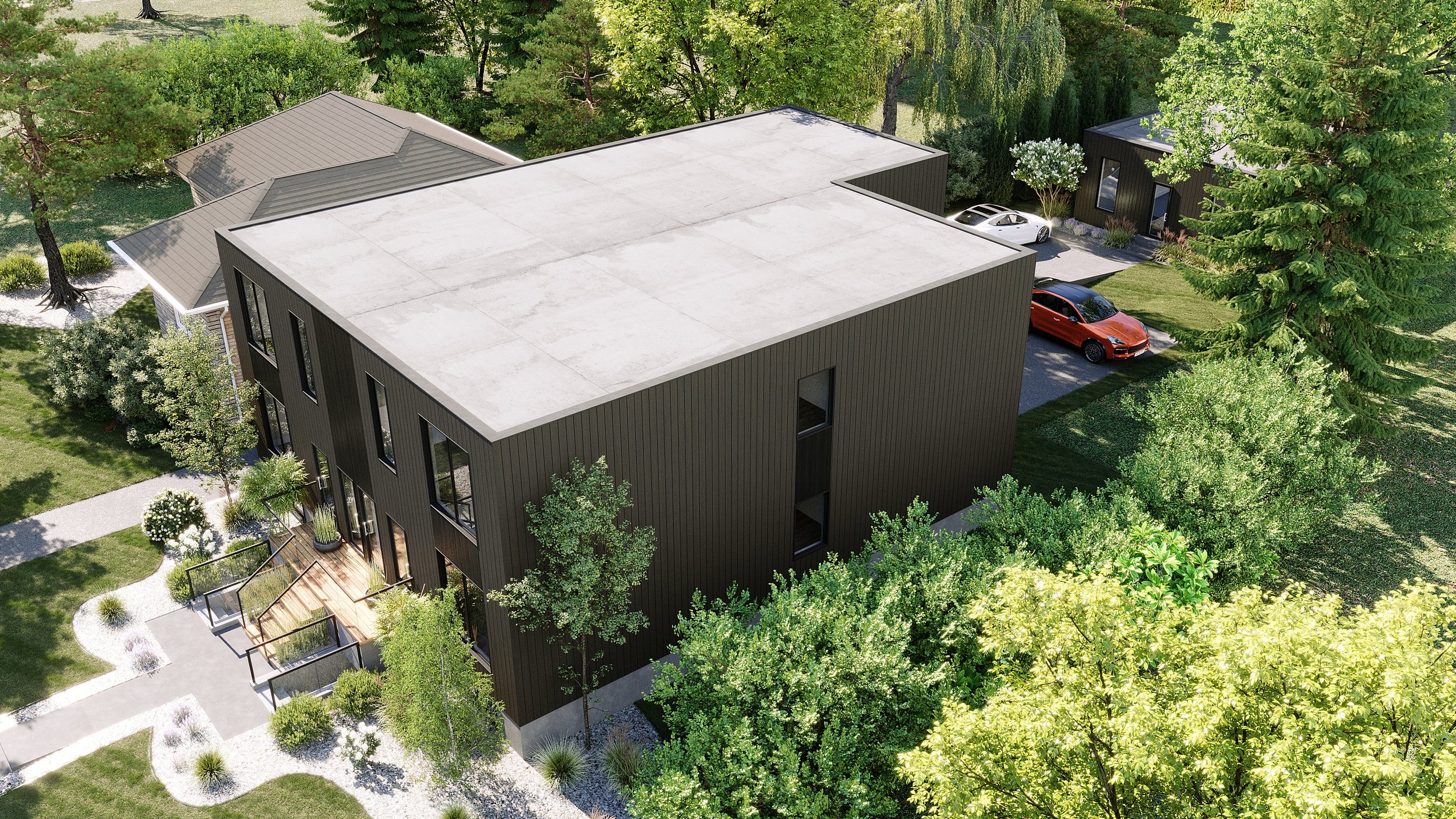 An aerial view of a modern black building with tall windows, surrounded by green trees, gardens, and a sidewalk, with parked cars nearby.