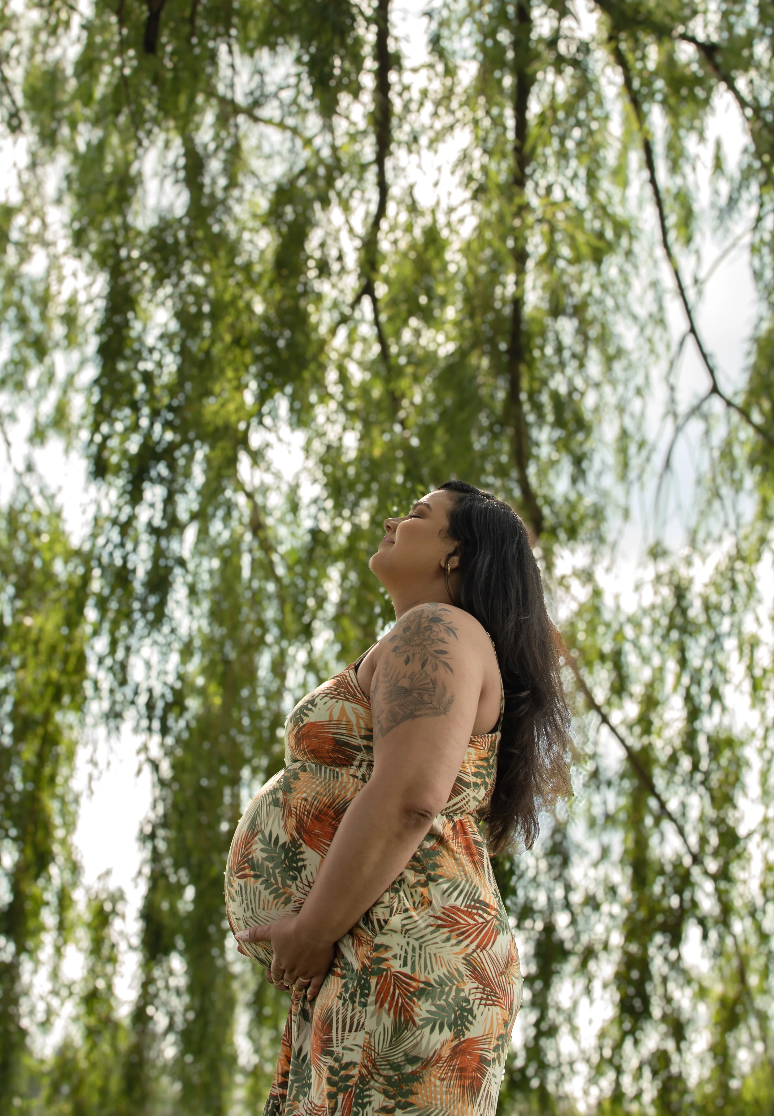 Maternity photoshoot in a natural outdoor setting, glowing, just like you