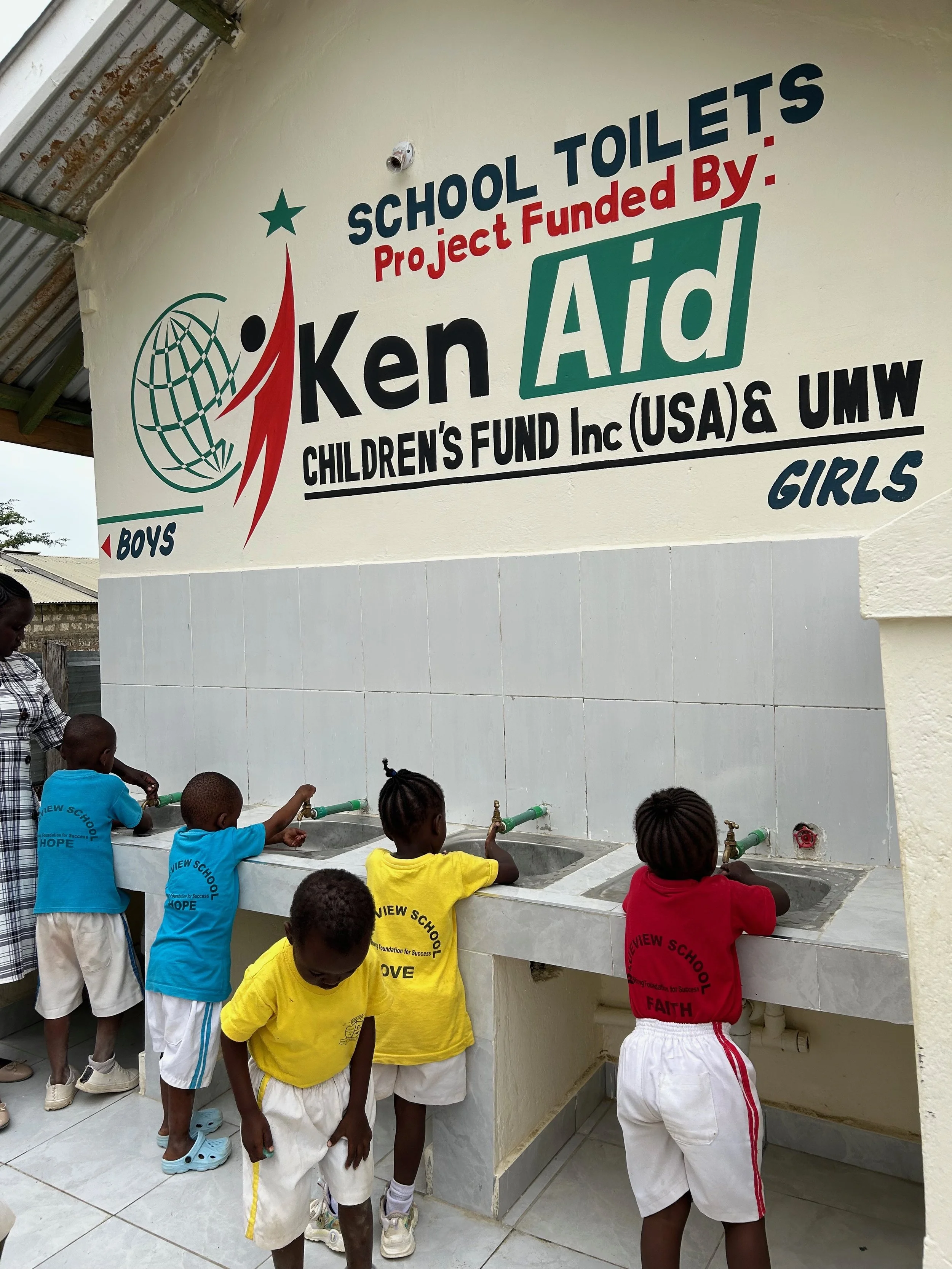 Children wash hands at new sinks