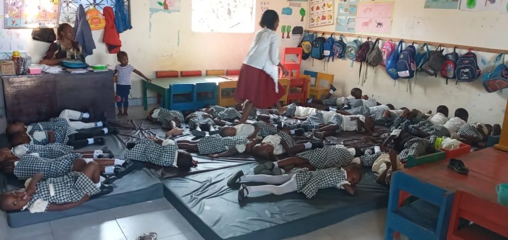 Baby class napping on mattresses from National United Methodist Church
