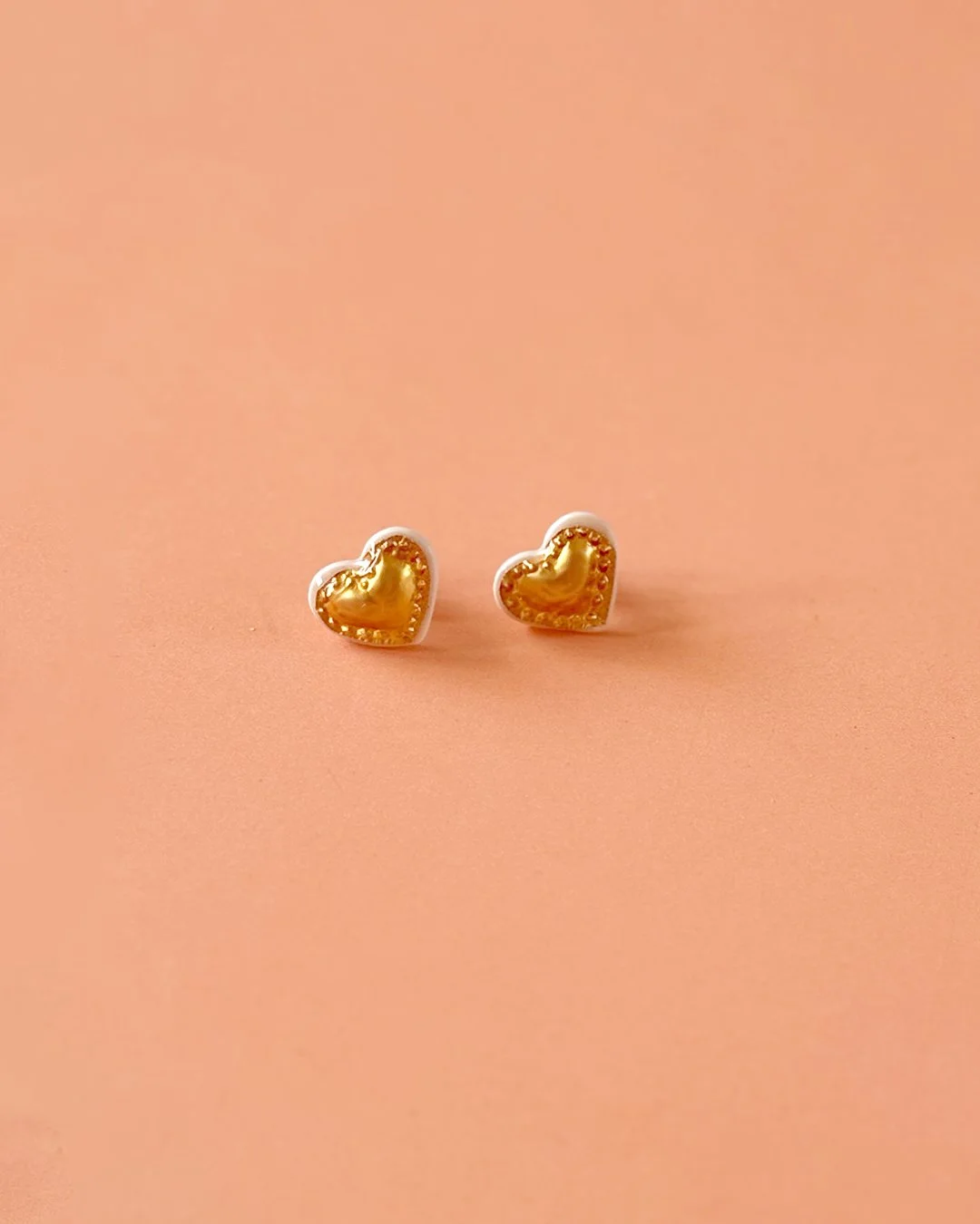 Boucles d'oreilles mini coeurs embossés