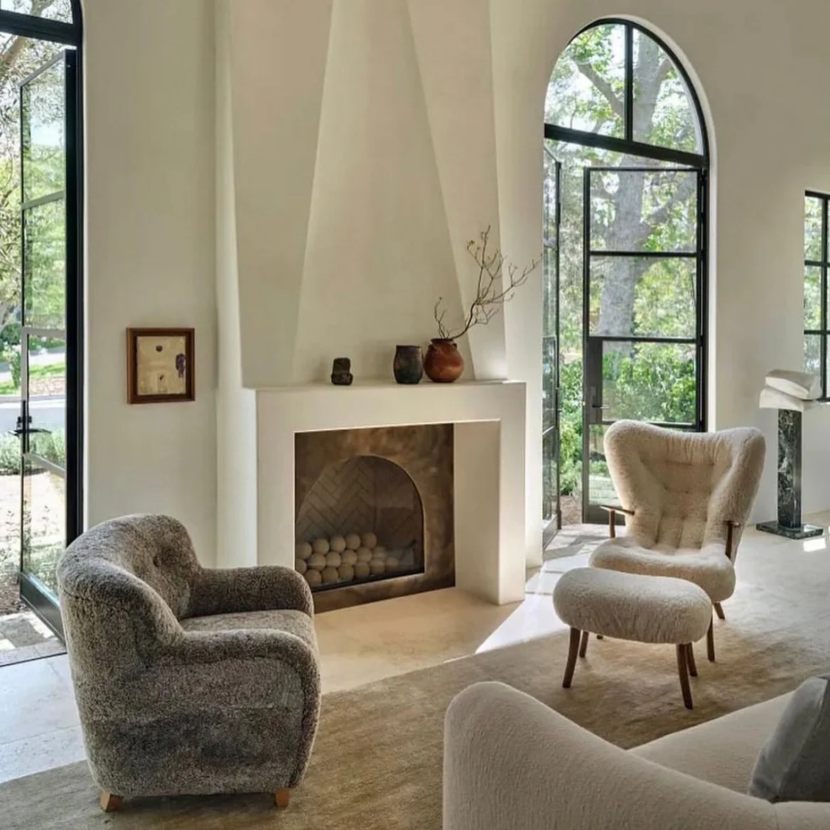 Jeremiah Brent has such a refined way with form. In this Los Angeles home, arches repeat throughout the architecture and furniture, even down to the fireplace, where a triangular mantle meets a curved interior.