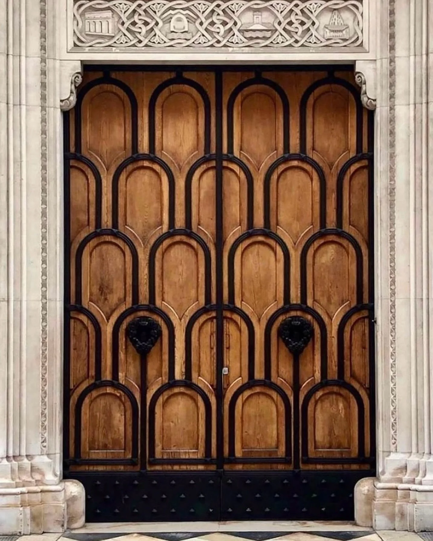 Mixed materials or iron and wood crate the Palazzo dell&rsquo;Acquedotto Pugliese entrance doors in Southern Italy.

Via @lindaboronkay