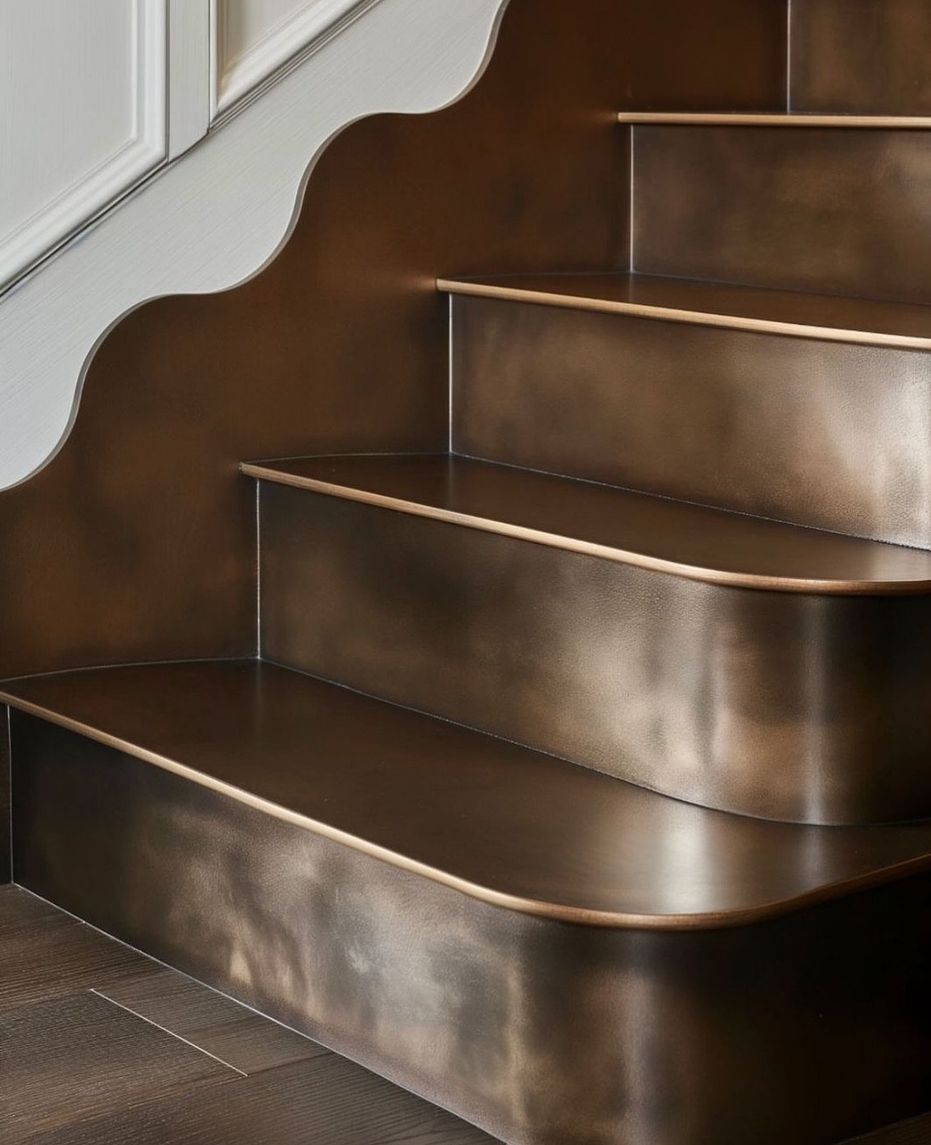 Design Detail: Bronze scalloped stairs.