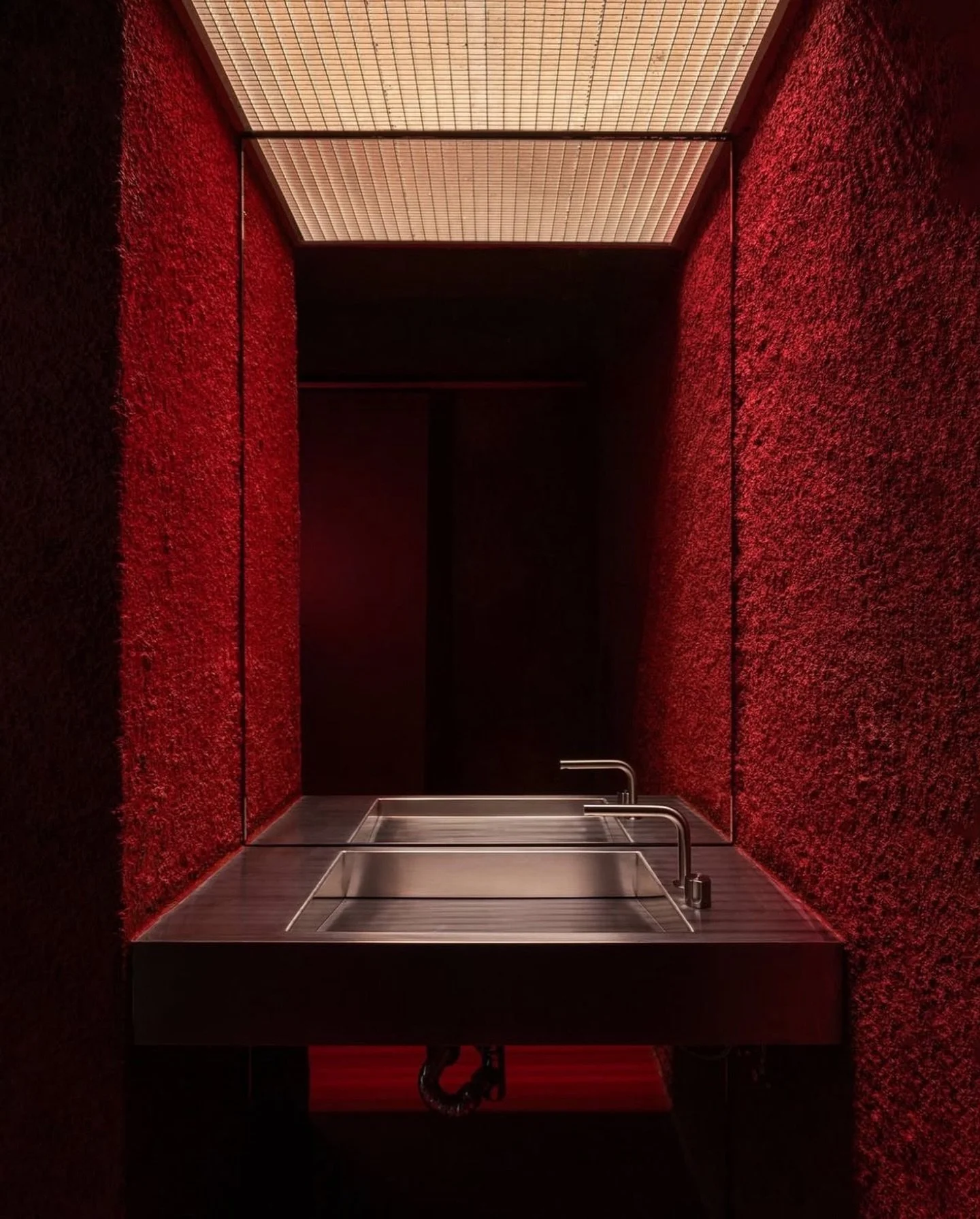 A powder room that&rsquo;s cinematic, saturated, and immersive.