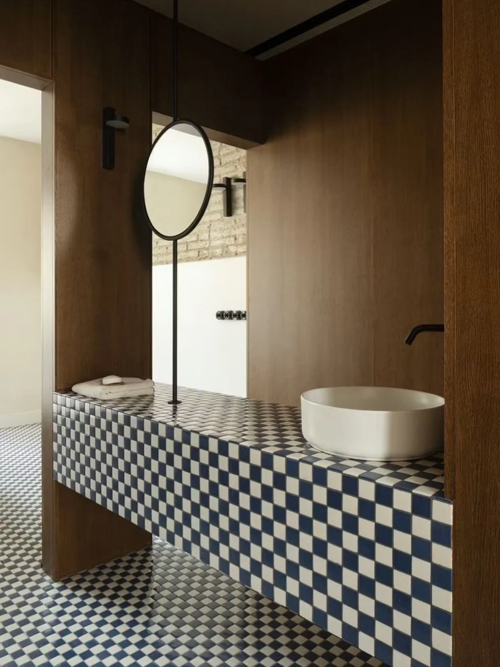 Maintaining functionality by using design repetition to make a bold geometric statement, complemented by a tonal palette to keep it calm.