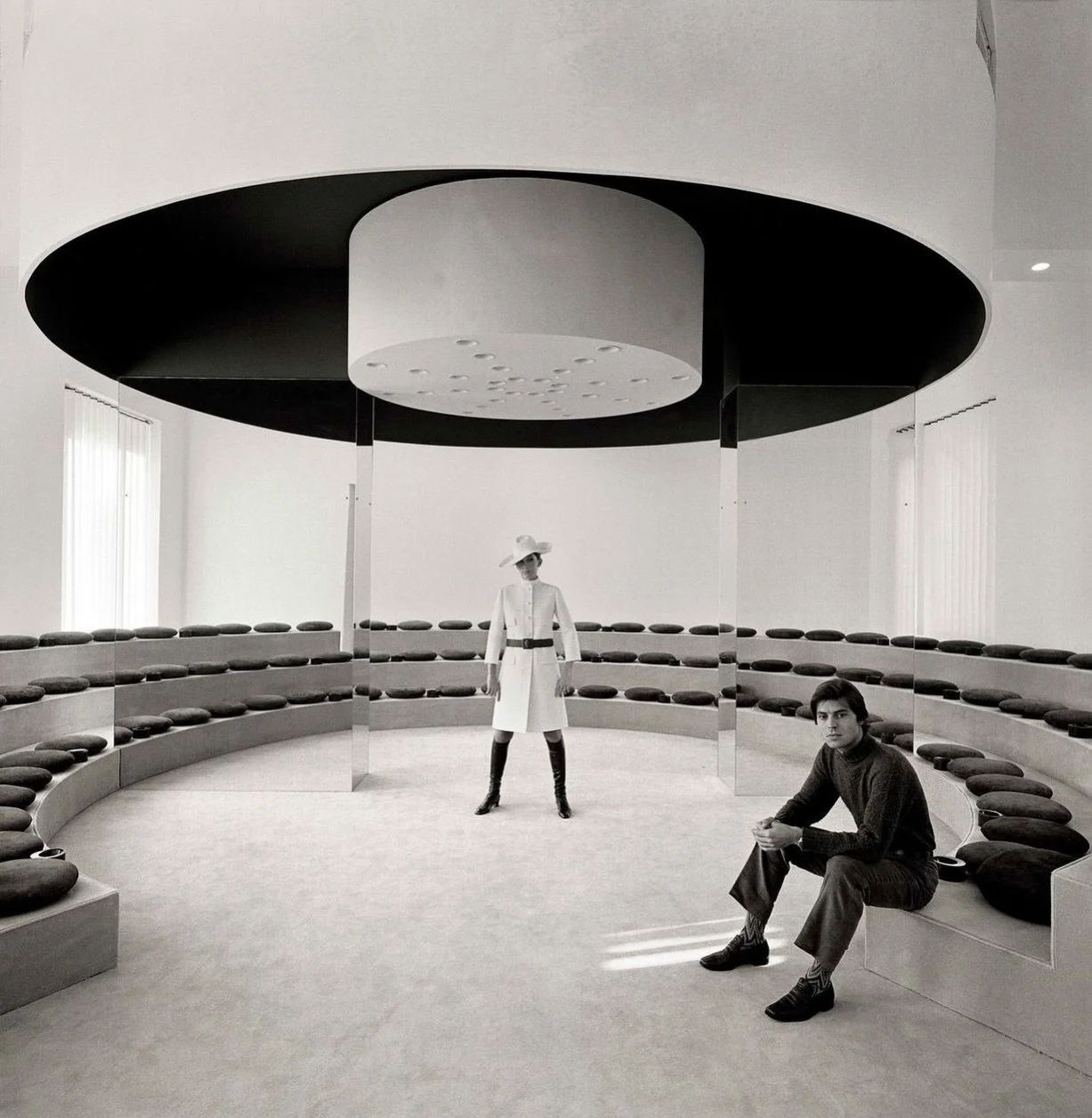 It feels like a scene before the dialogue starts. The Olivetti showroom in Paris was designed by the renowned female architect Gae Aulenti in 1967.