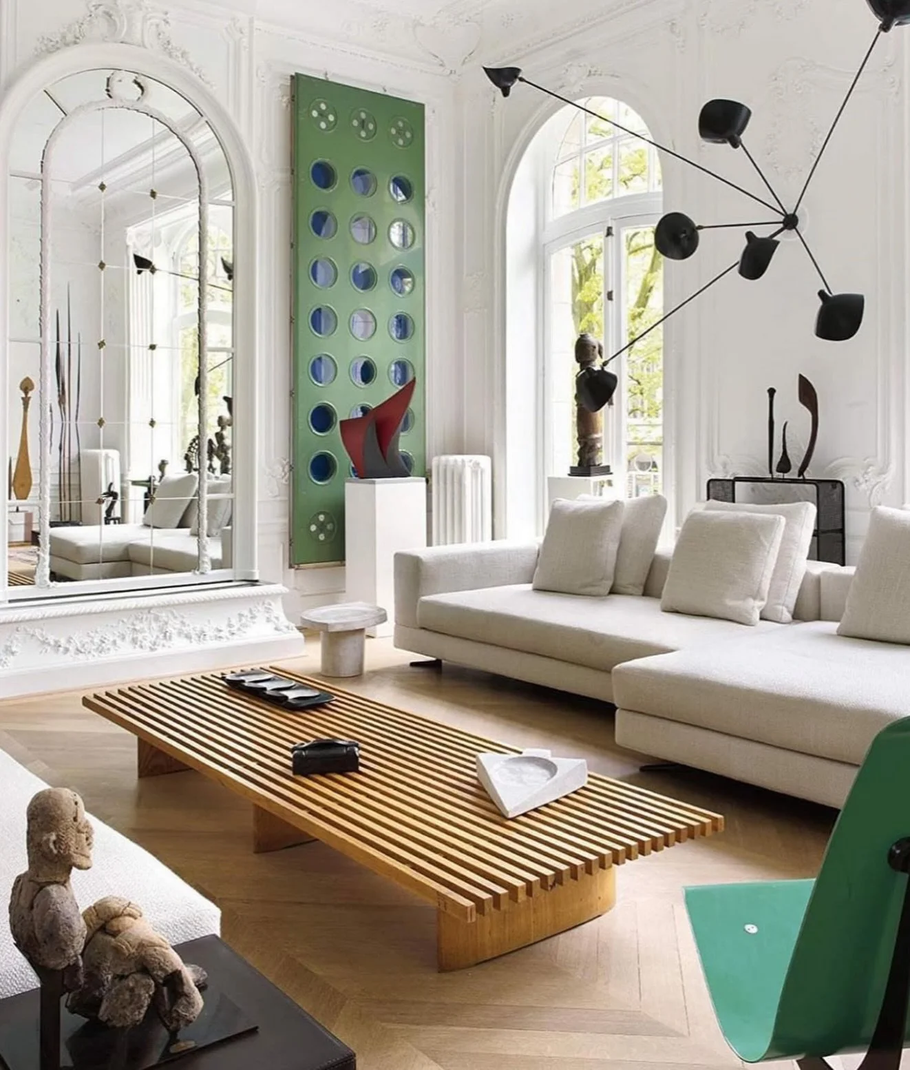 I&rsquo;m always drawn to spaces that resist one clear category. Traditional Parisian architecture, modern forms, graphic color moments interrupting calm neutrals, collected art, and minimal furniture. A room full of contrast and wins because of it.