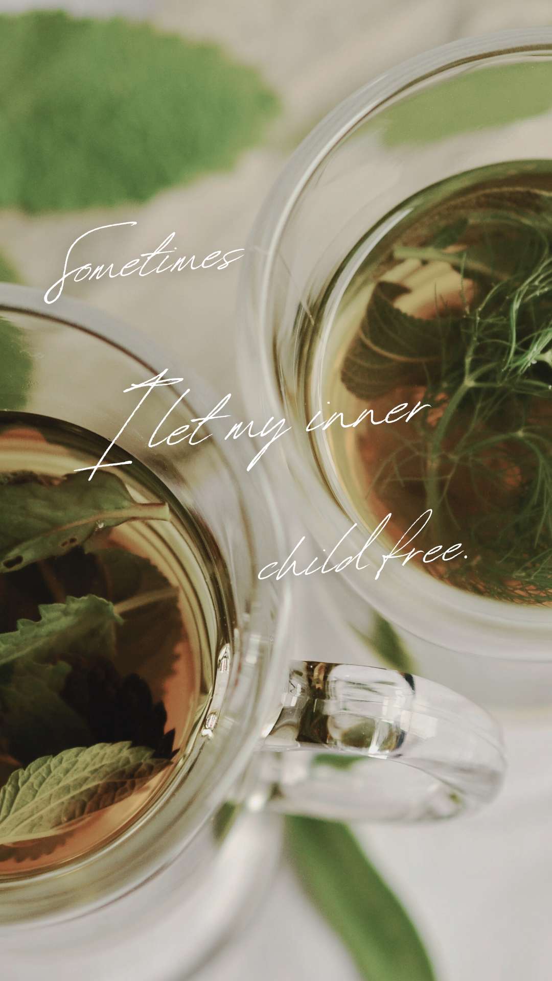 Two glass cups of herbal tea with mint and other herbs, with a green leaf in the background. Overlaid text says, 'sometimes let my inner child free.'