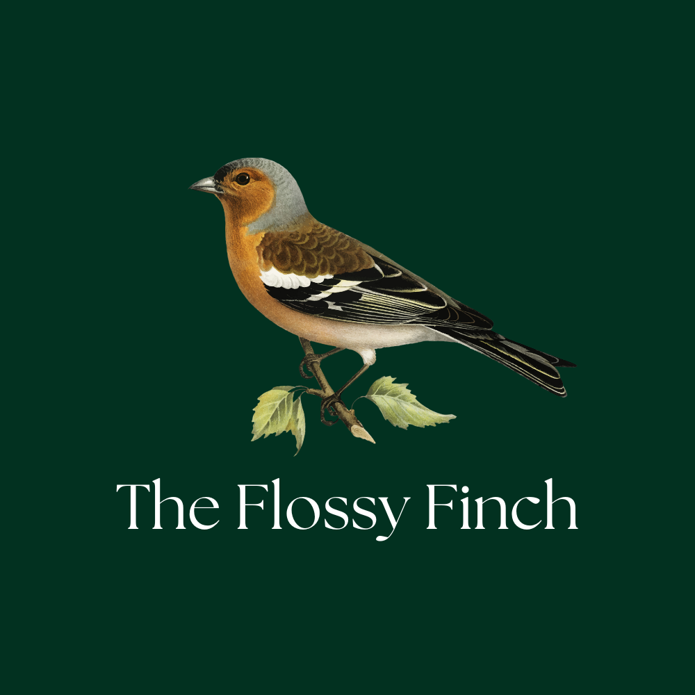 Illustration of a bird with a brown and gray body perched on a small branch with green leaves, with the text 'The Flossy Finch' below.