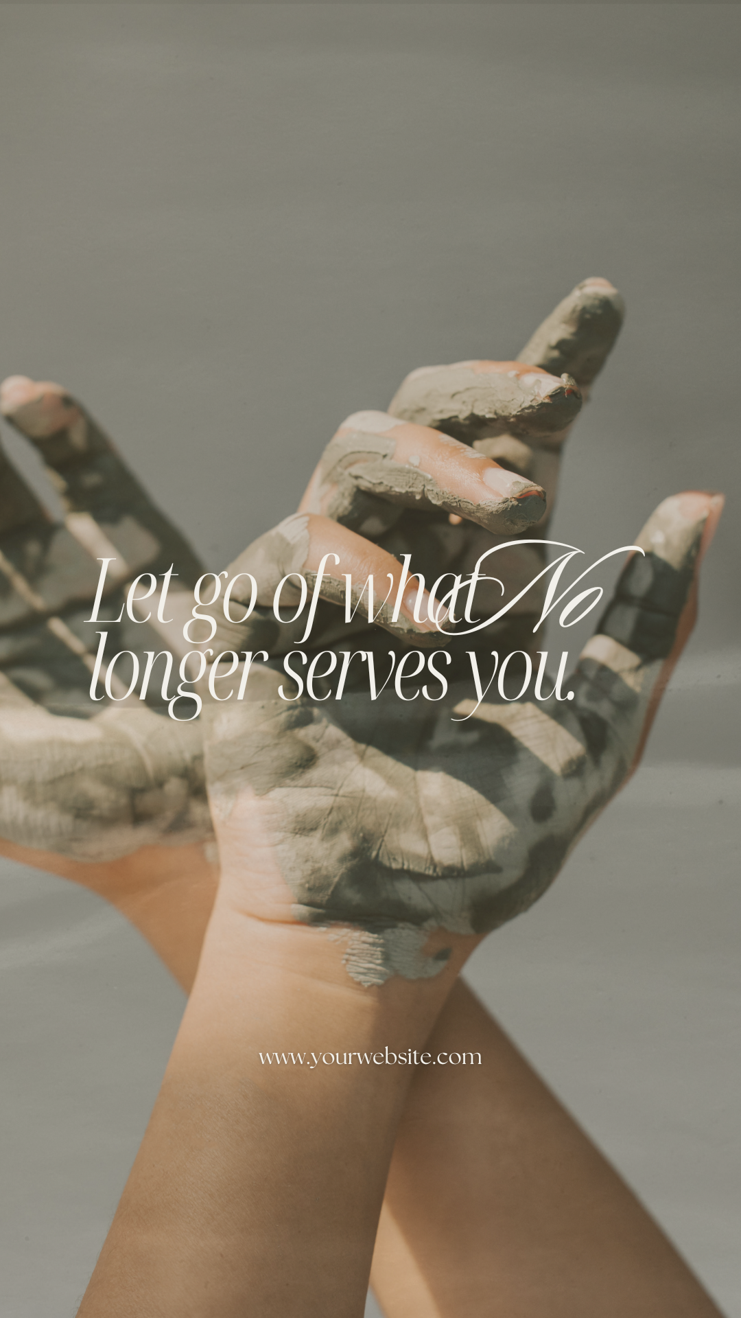 A hand covered in gray mud with fingers slightly curled, with text overlay that reads 'Let go of what no longer serves you,' and a website URL at the bottom.