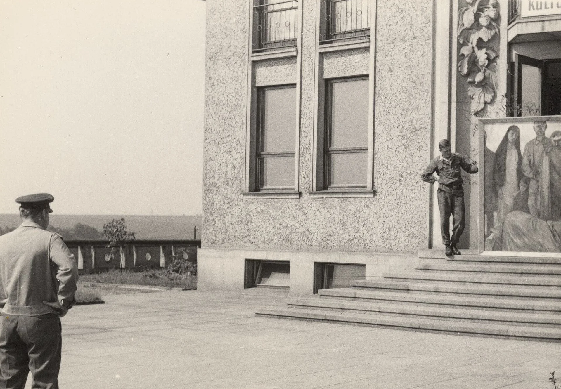 Artworks arrive to Lidice in 1967. A volunteer poses with Savickas painting "Victims of Fascism" in the door of Lidice Cultural House
