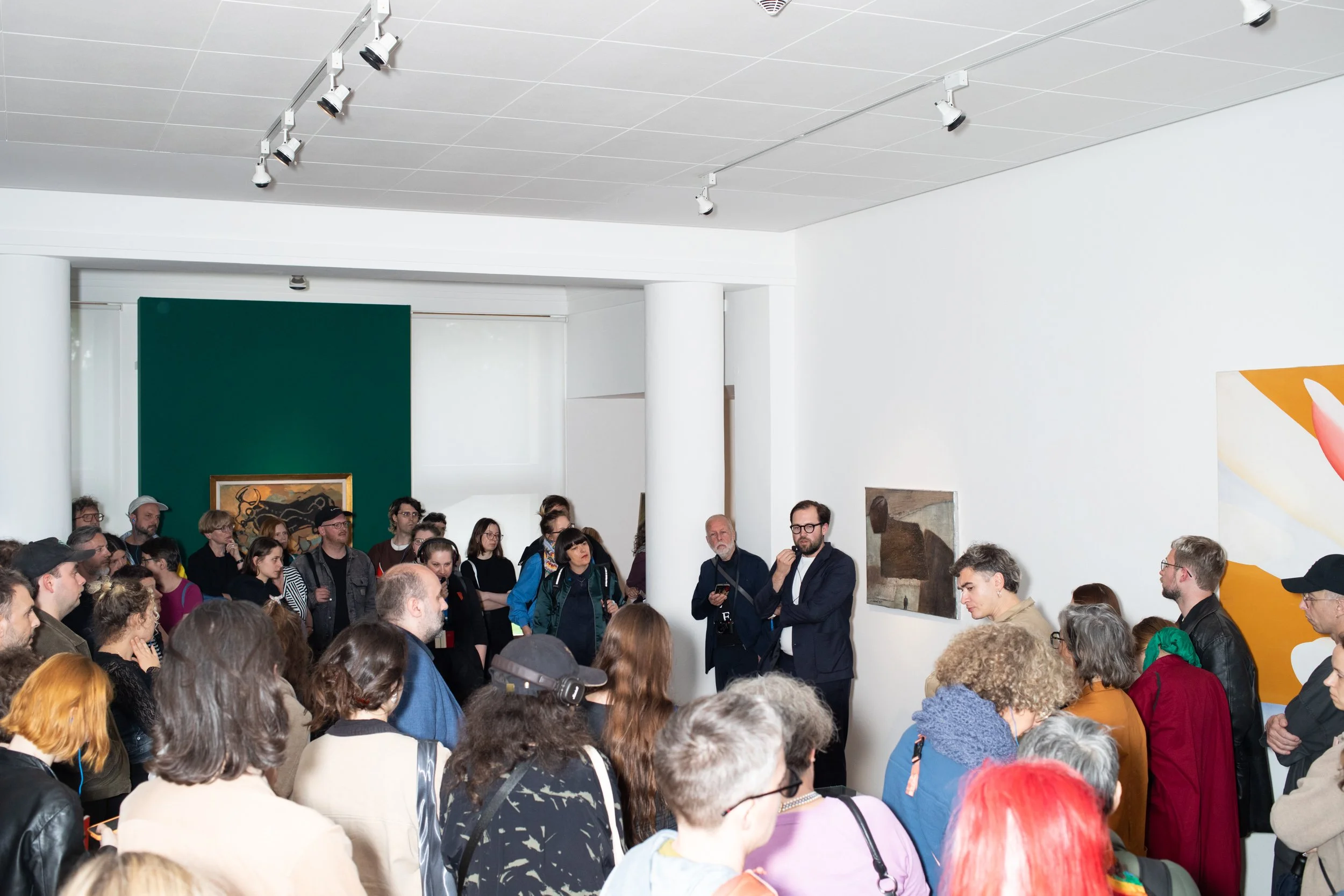 Many people stand inside the Lidice Art Collection display in Lidice Gallery during the opening of Biennial Matter of Art in 2024.