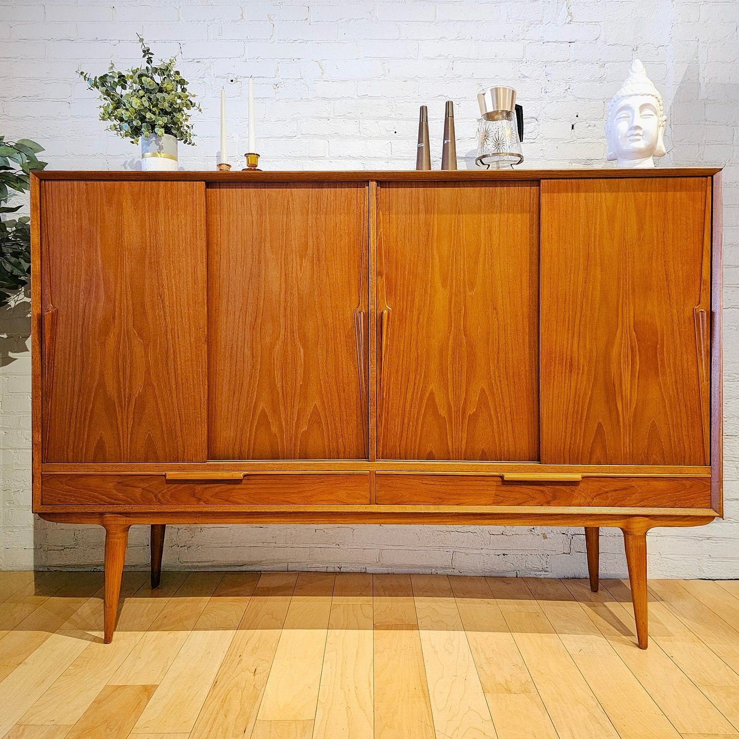 SHOWROOM SALE // Day 1
We’re kicking off a week of daily sale features—and today’s is a heavy hitter.
Meet your new favorite storage upgrade:
This Danish teak four-door sideboard by Gunni Omann for Omann Jun is pure 1960s perfectio