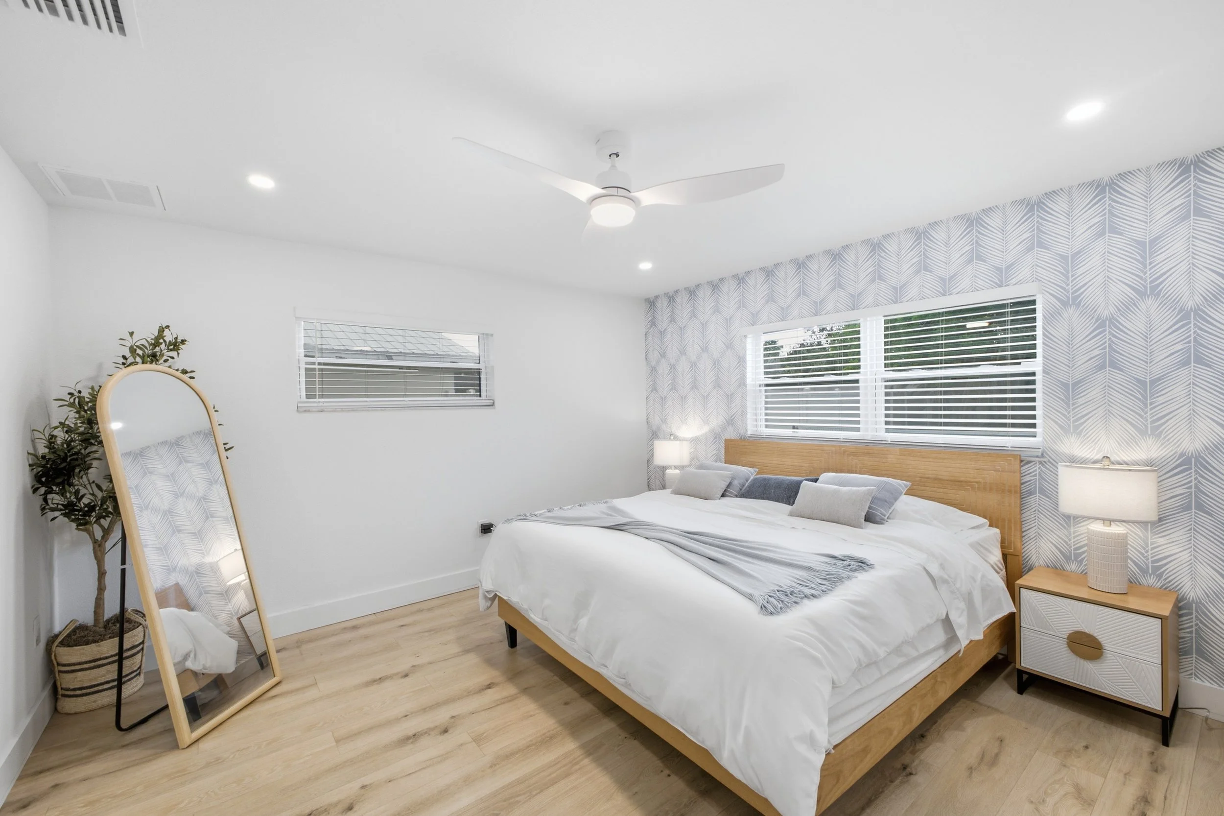 Luxury primary bedroom photography for a Sarasota real estate listing.