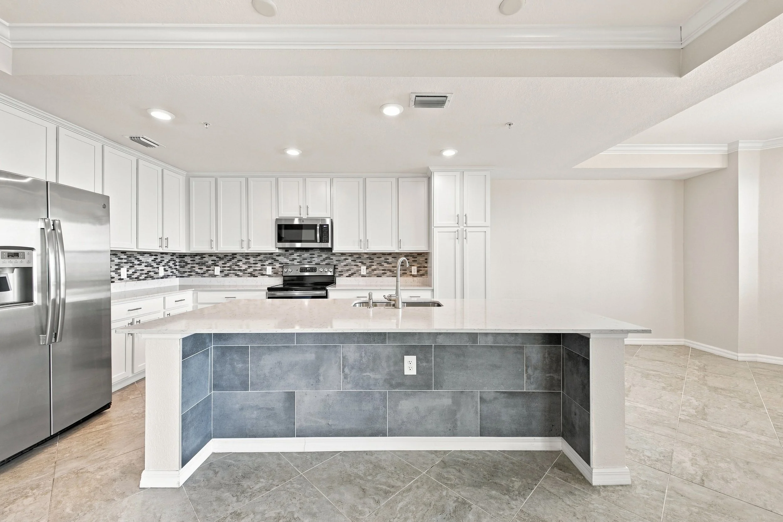 Professional real estate photography in Bradenton, FL showcasing a bright, modern kitchen.
