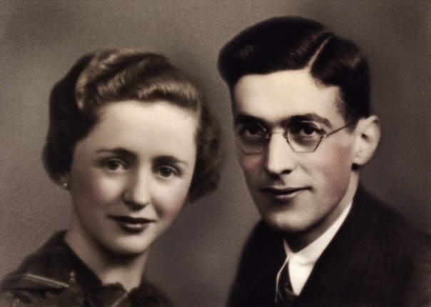 A lightly colorized black and white photo of a young white couple taken in the 1930s.