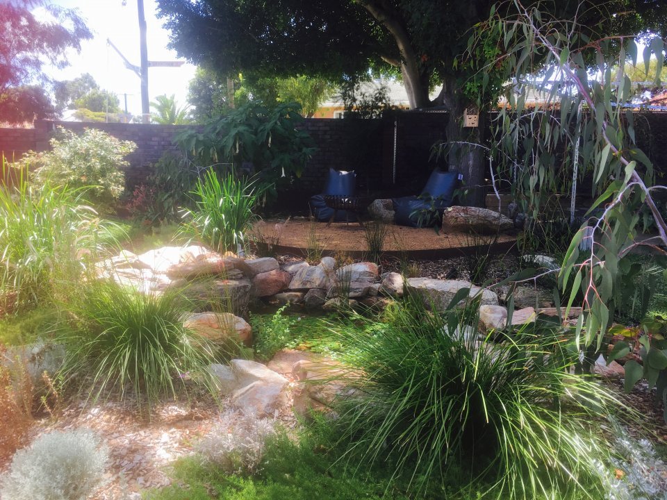 AFTER: Full design: new firepit area with natural pond. Install: Think Green Landscapes