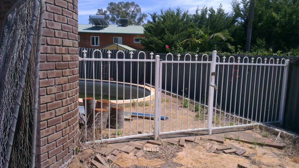 BEFORE: Uninspiring pool fence