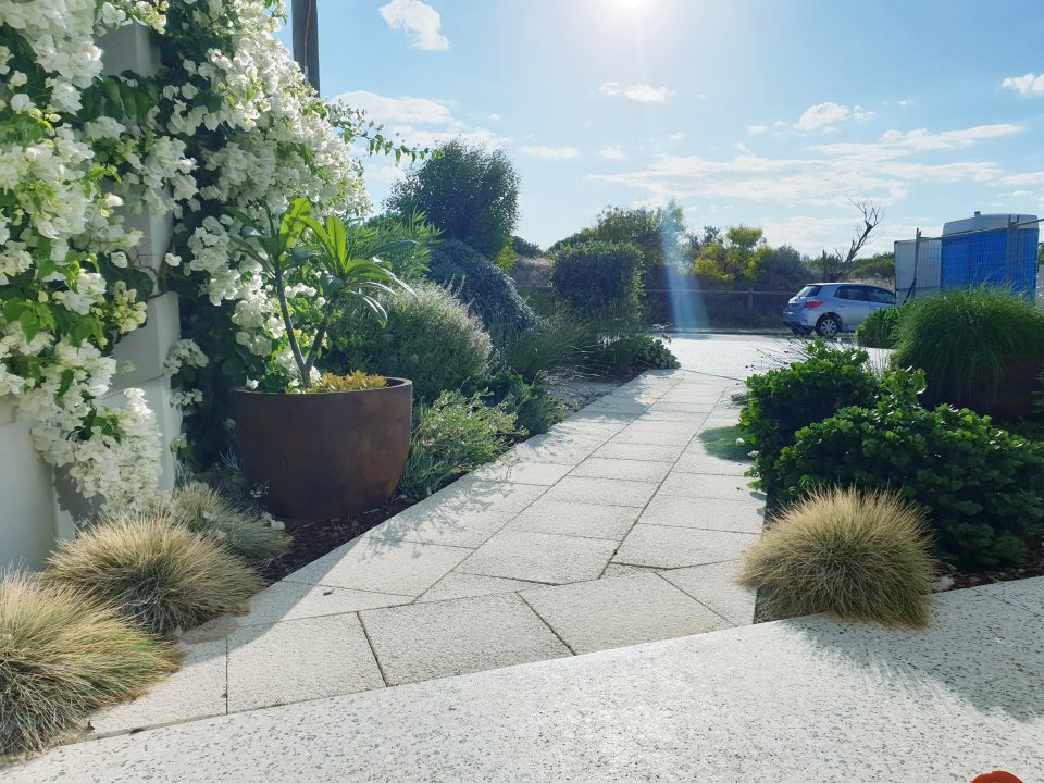 AFTER: Path to the beach flanked by tough plants for harsh coastal conditions