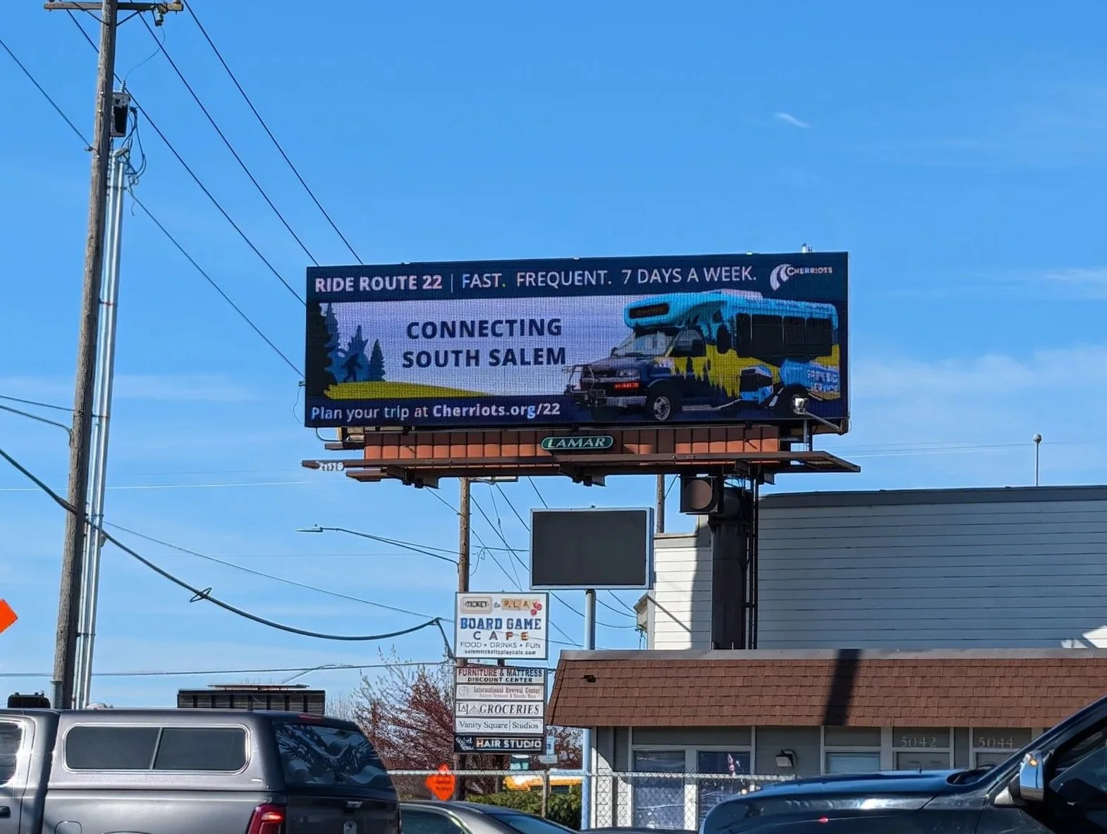 Digital billboards at South Salem intersections with pedestrian foot traffic 