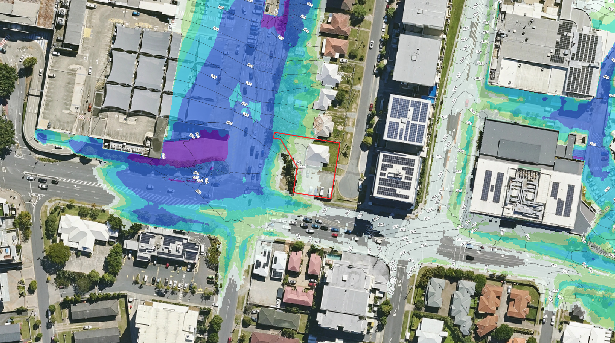 TUFLOW flood depth model showing simulated flood depths across a proposed development site for a flood engineering assessment.