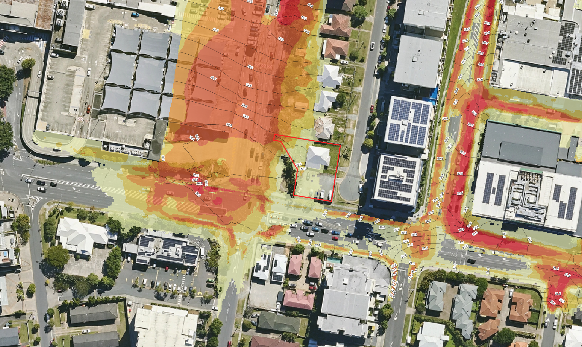 TUFLOW flood velocity model showing simulated flood flow velocities across a proposed development site for a flood engineering assessment.