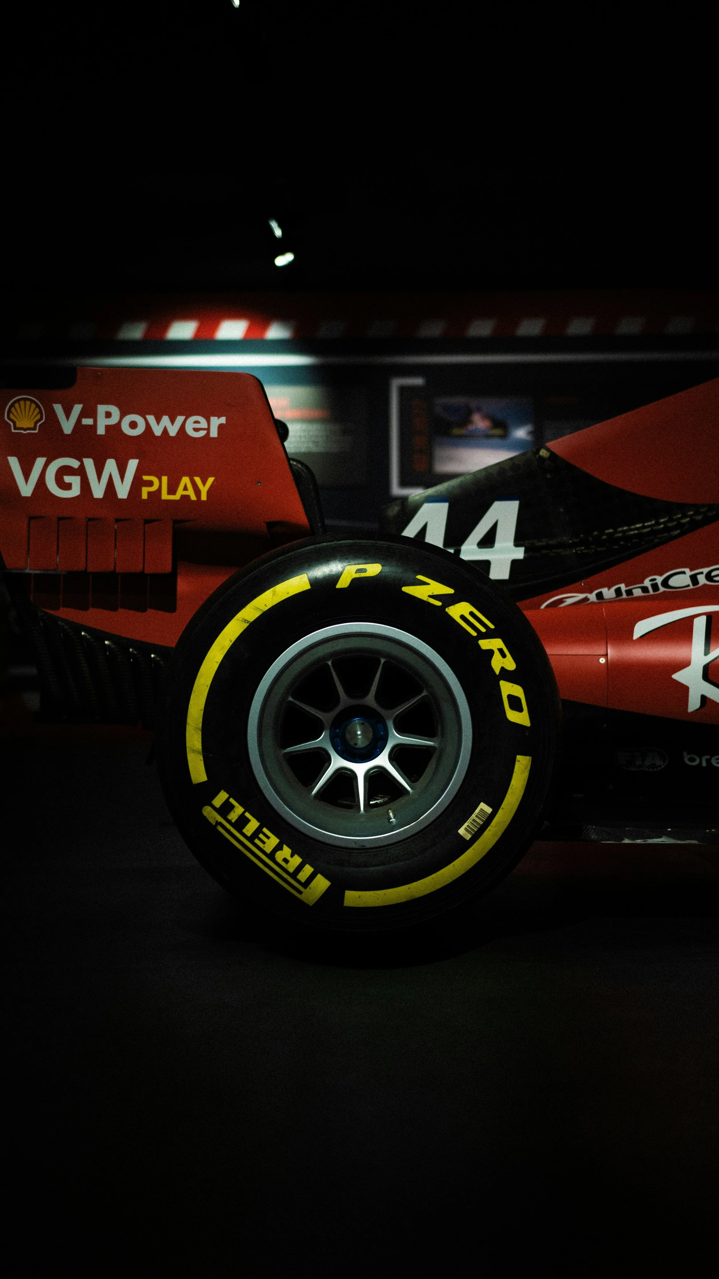 Close-up detail of a Formula 1 car wheel and sponsor branding.