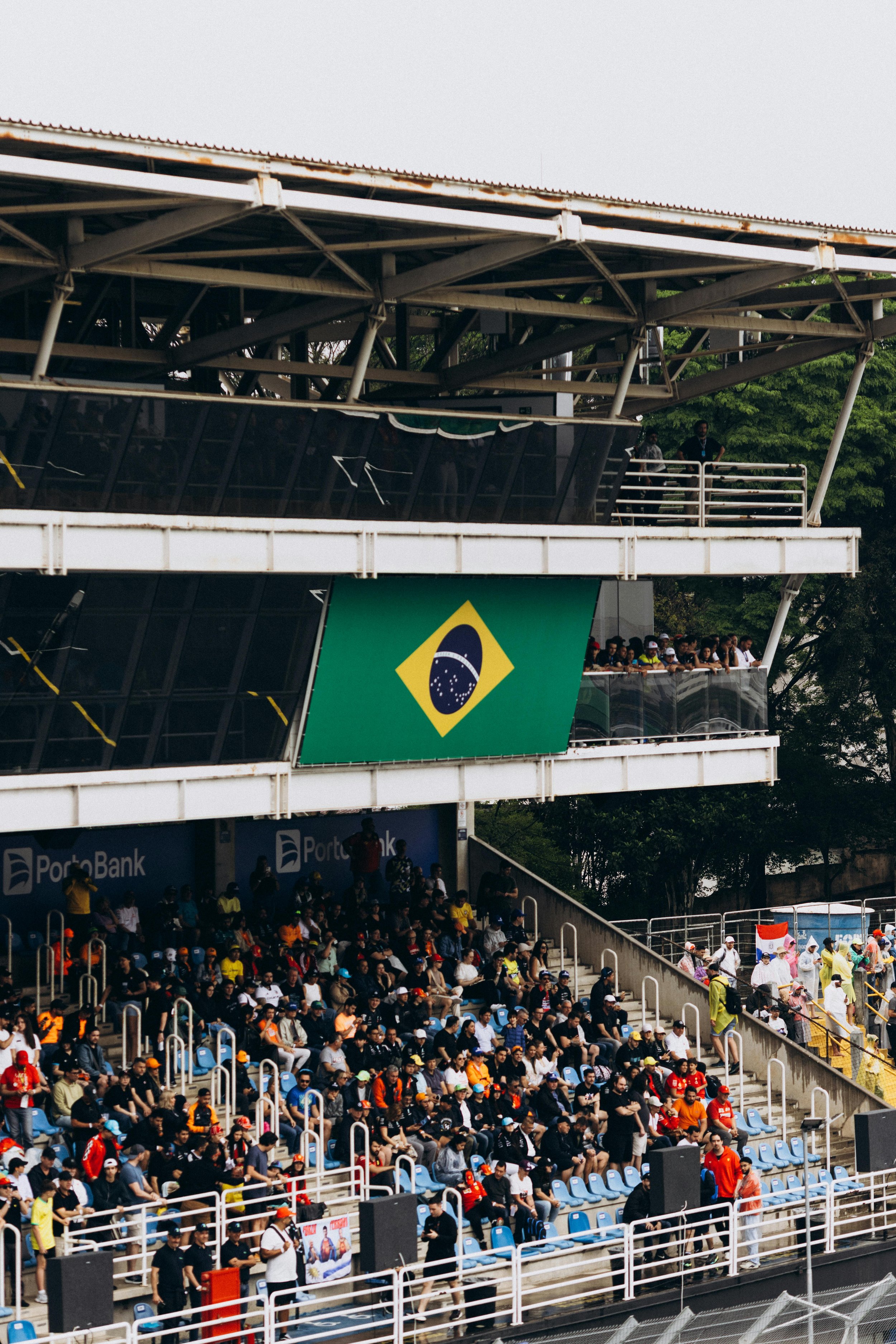 Crowd in grandstands at a Formula 1 race showing fan engagement and local race atmosphere
