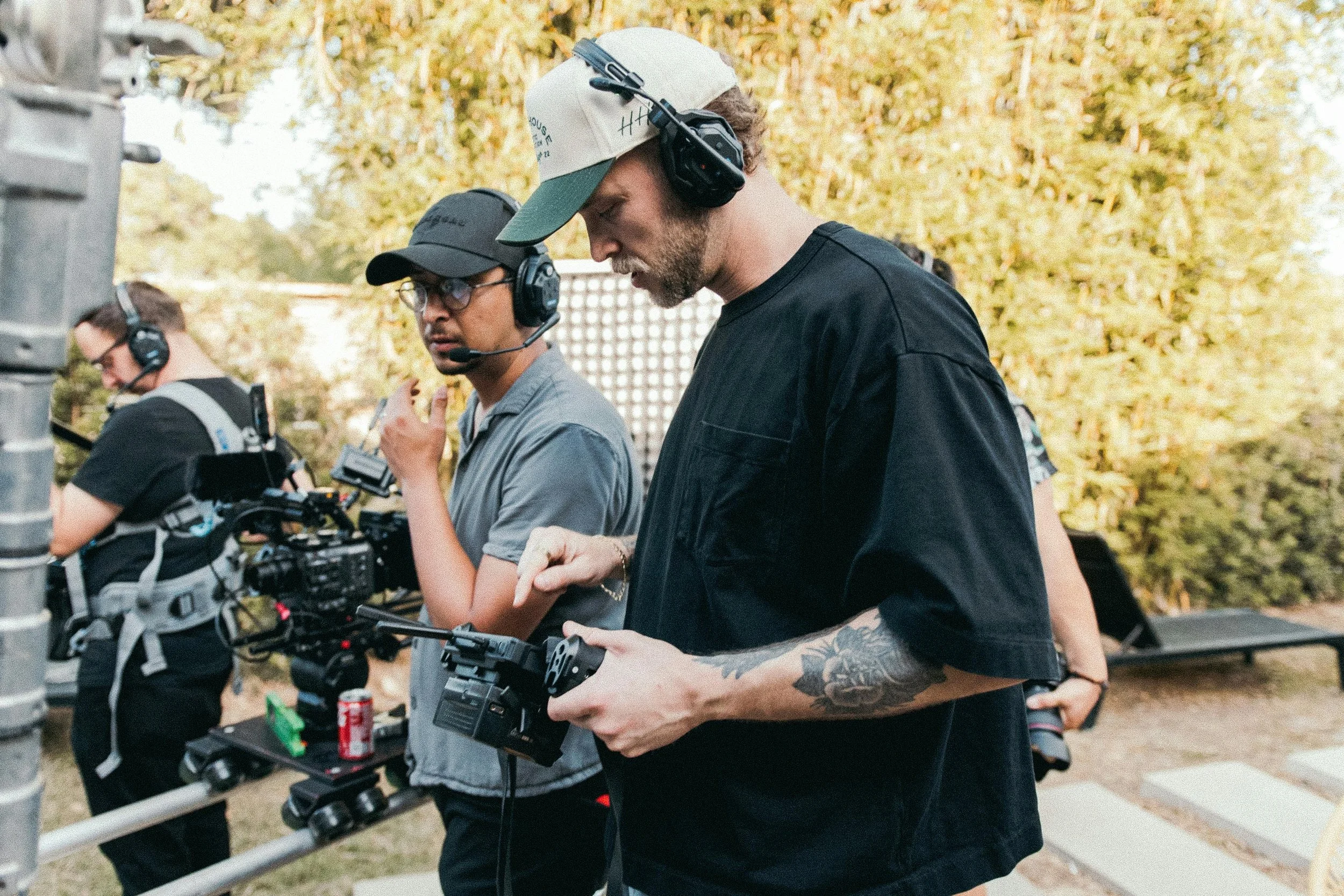 F1 content production team filming during a Formula 1 filming day with professional camera equipment