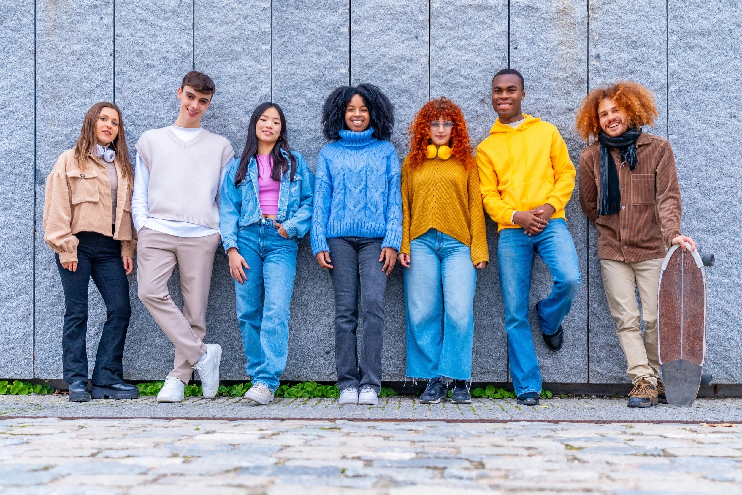 multi-ethnic-group-of-friends-leaning-on-an-urban-2023-12-19-03-34-50-utc.jpg