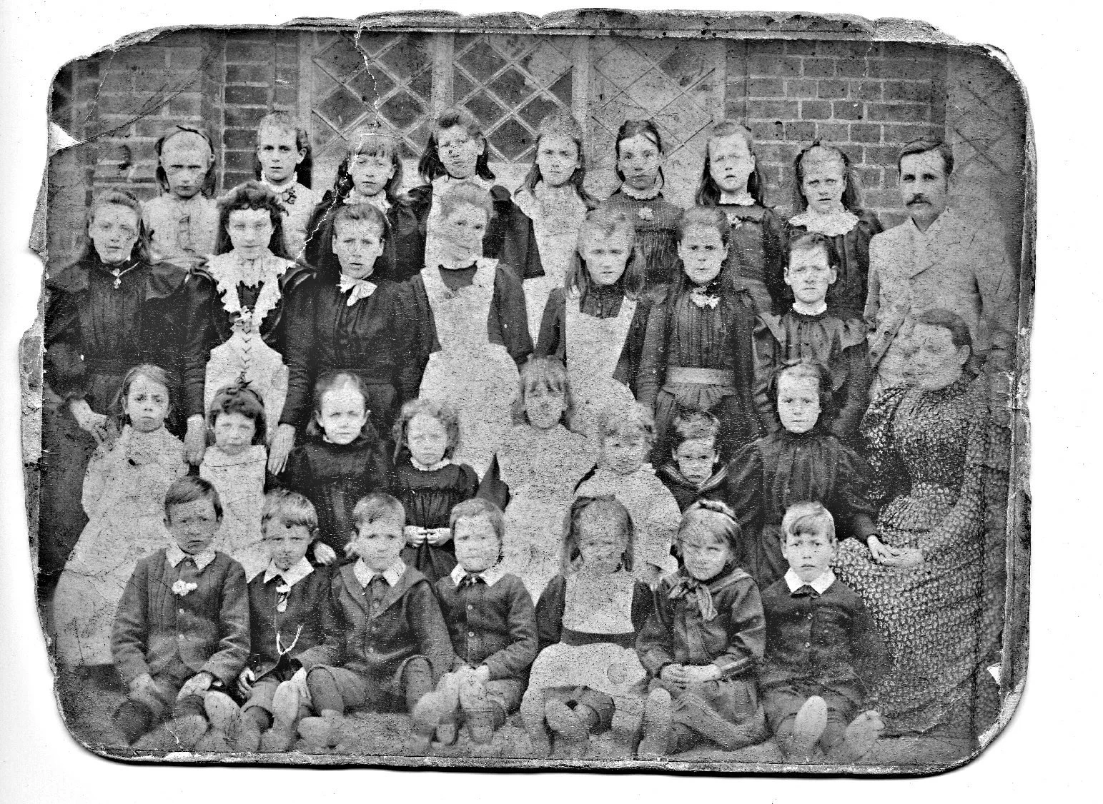 Historic photograph of Great Snoring School pupils and schoolmaster Harry Green, circa 1900.