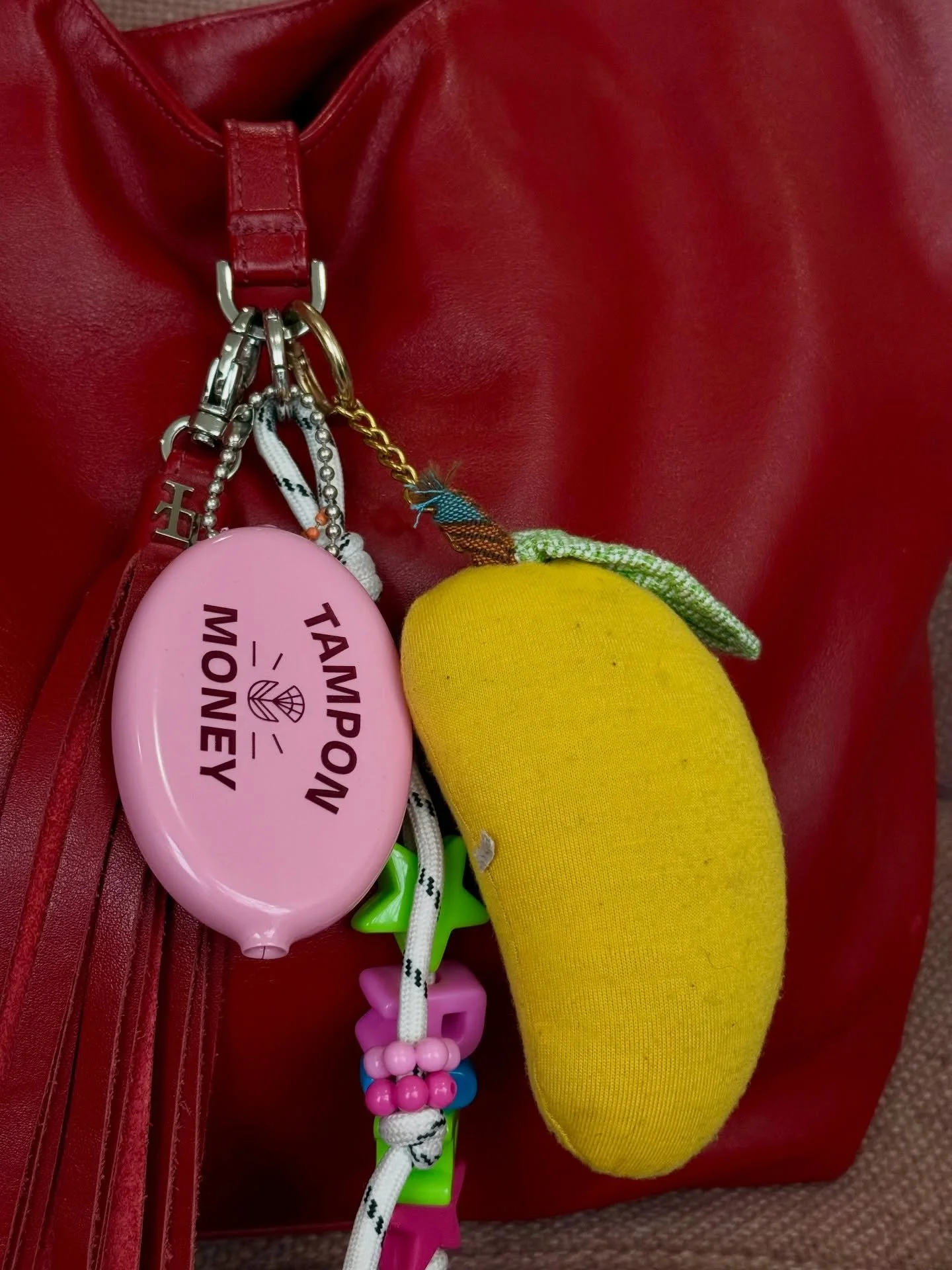 Bag charms are in, but bag charms with function keep your piece in the rotation. Coin pouches are the perfect mix of both with a little sparkle of nostalgia. Tampon Money pouches for @accessperiod for Equal Pay Day! 

The second photo I snapped at th