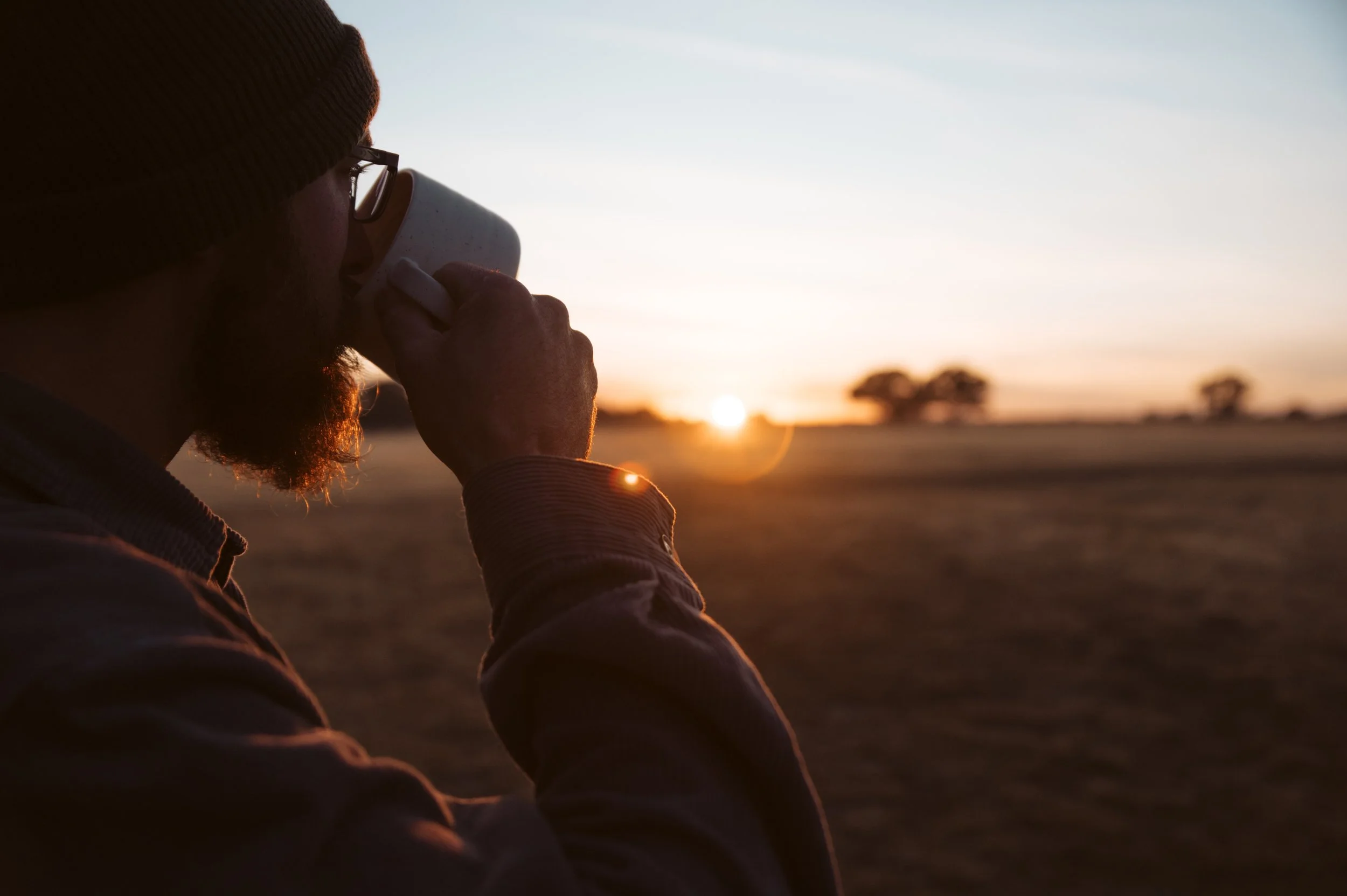 Morning coffee at sunrise during an off-grid stay in the Grampians, Victoria.