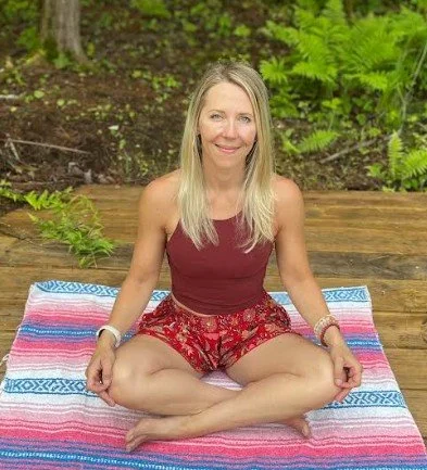 Christi Leclair practicing outdoor yoga on the deck at RISEilience. She is a gifted practitioner in Amesbury known for her intuitive Tarot, Oracle, and Crystal readings.