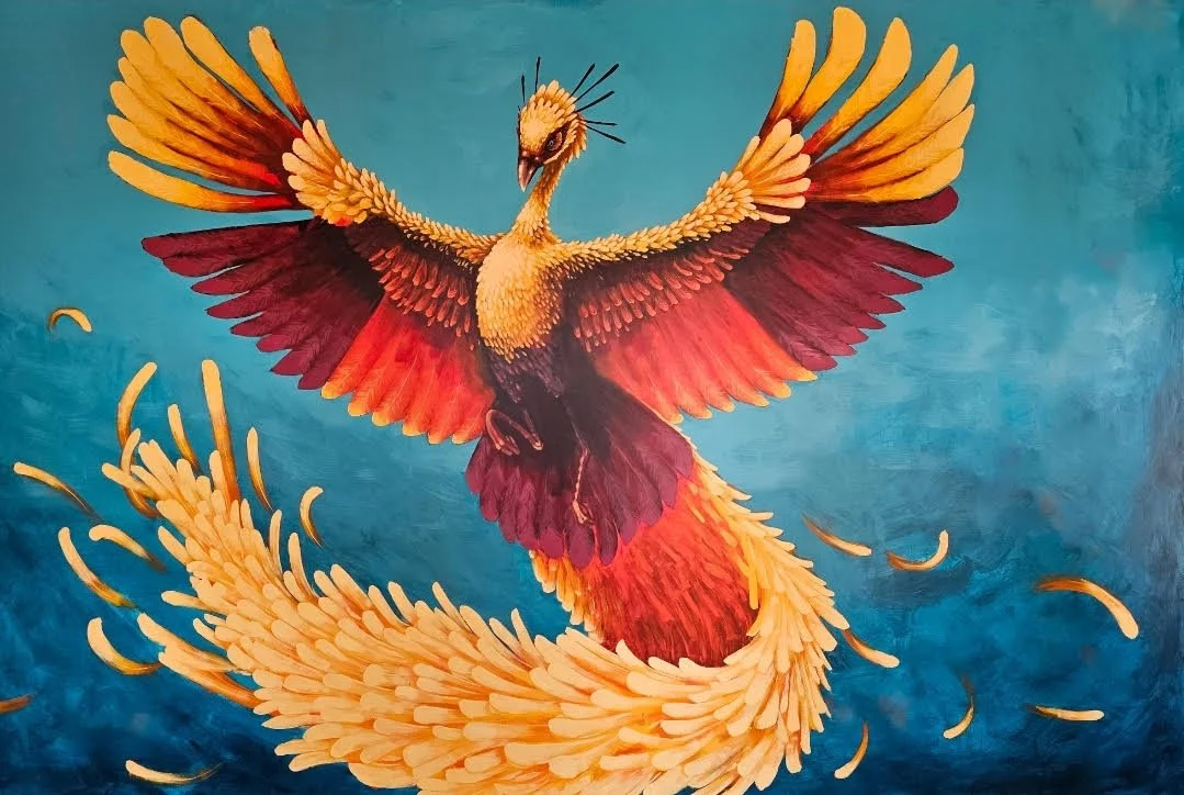 A colorful phoenix with orange, red, and yellow feathers soaring against a blue background.